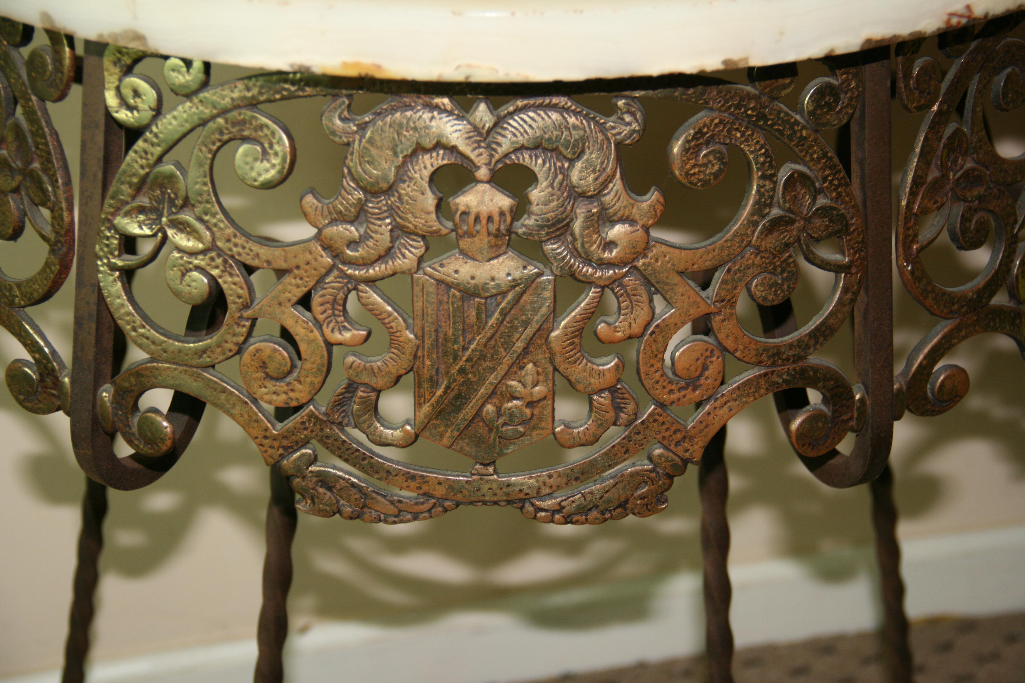 Antique Iron and Brass Heraldry Demi lune Console with Onyx Top In Good Condition In Douglas Manor, NY