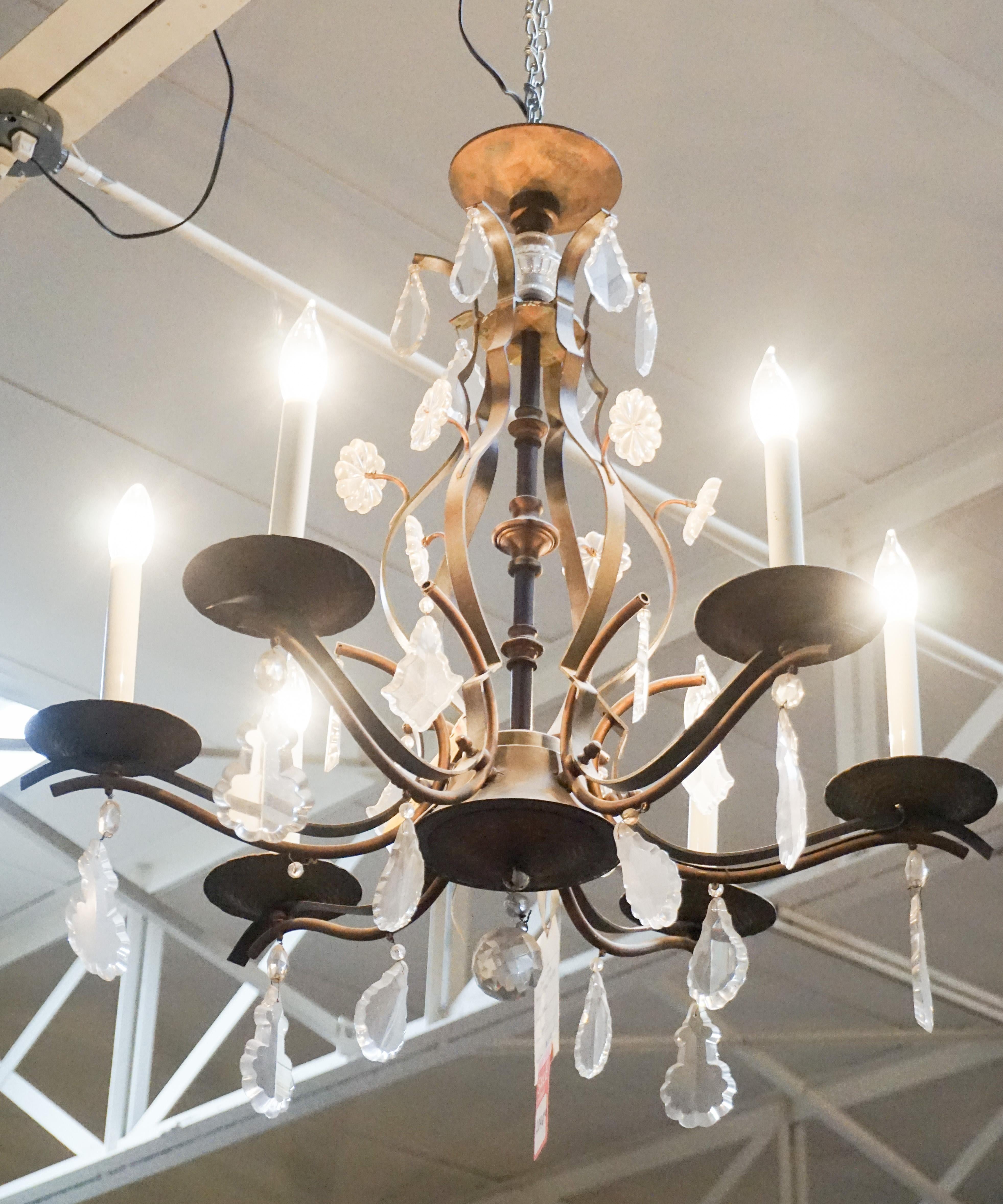 This antique chandelier is made of iron and glass. Originates from France, circa 1880.

Measurements: 29'' H x 24'' W.