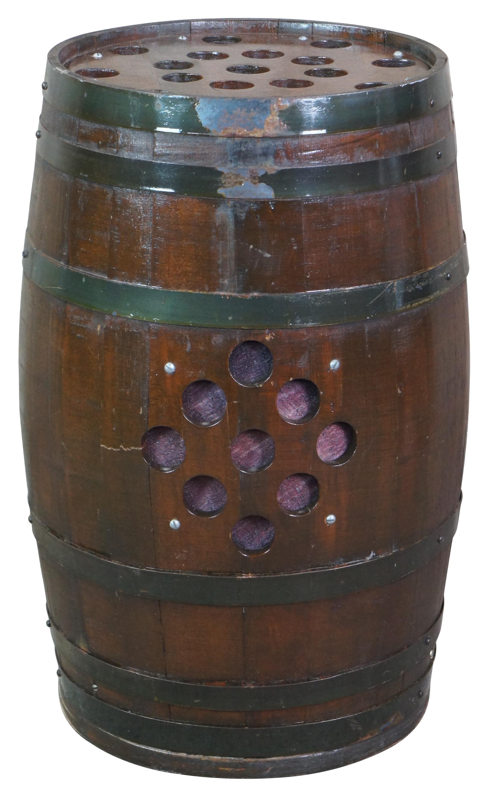 An antique whisky barrel that was converted into a speaker in the 1960s. Beautifully designed with metal banding and port holes for sound. Measure: 25