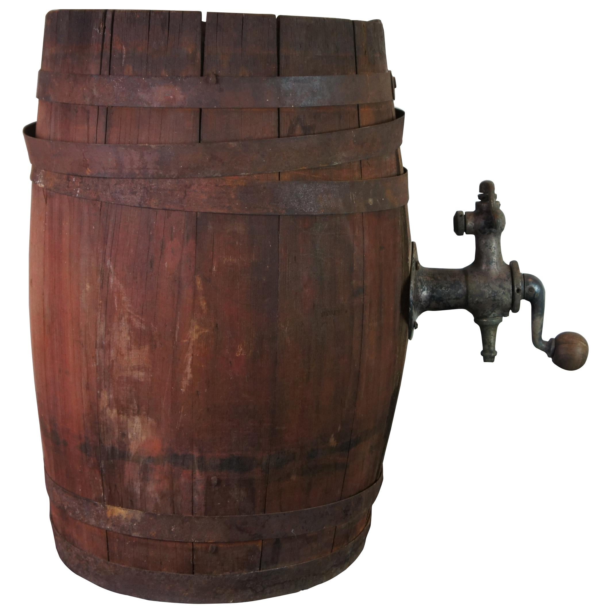 Antique wood iron banded beer or whiskey barrel keg with crank spigot.
   