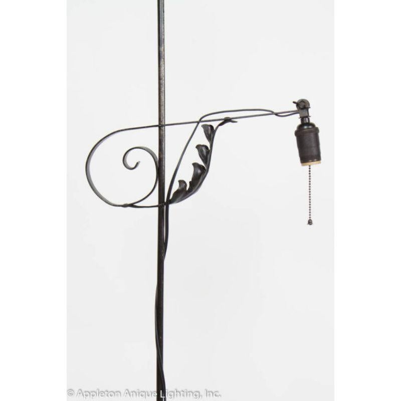 Iron Bridge Lamp with unusual long delicate legs. Spider like. Shade is painted mica, 12? diameter.

Material: Wrought Iron
Style: Arts & Crafts,Americana
Place of Origin: United States
Period made: Early 20th Century
Dimensions: 21 × 17 × 63