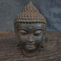 Ancienne tête de bouddha asiatique en fer