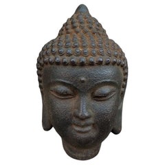 Ancienne tête de bouddha asiatique en fer