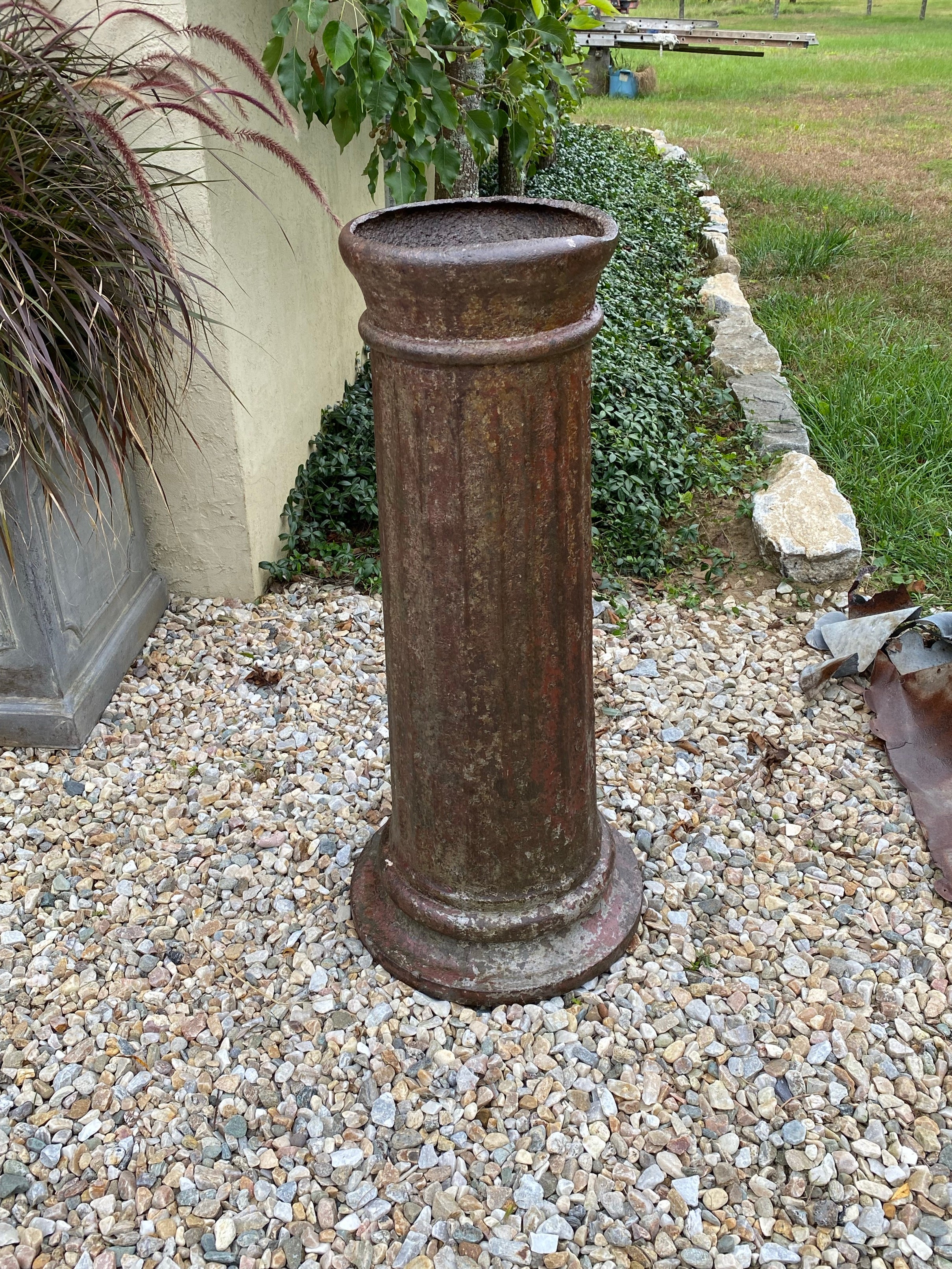 An antique cast iron column pedestal base. Use it to support an outdoor sculpture to make a perfect statement. Pedestal has wonderful aged patina.
If item is larger or smaller than the 10.75