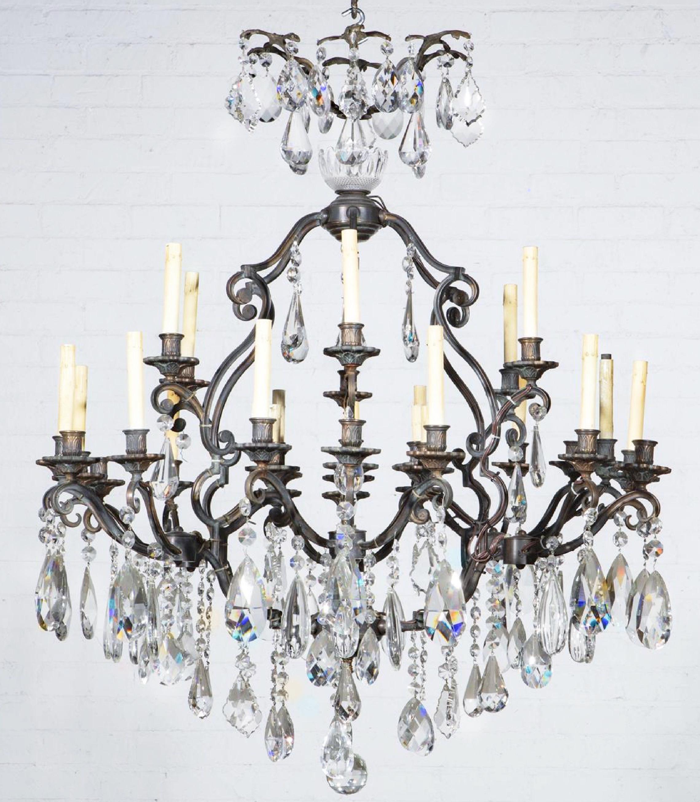 Stunning cast iron cut crystal thirty light chandelier, early 20th century
Measures: height 48in (122cm); diameter 43in (109cm) approximately.
 
