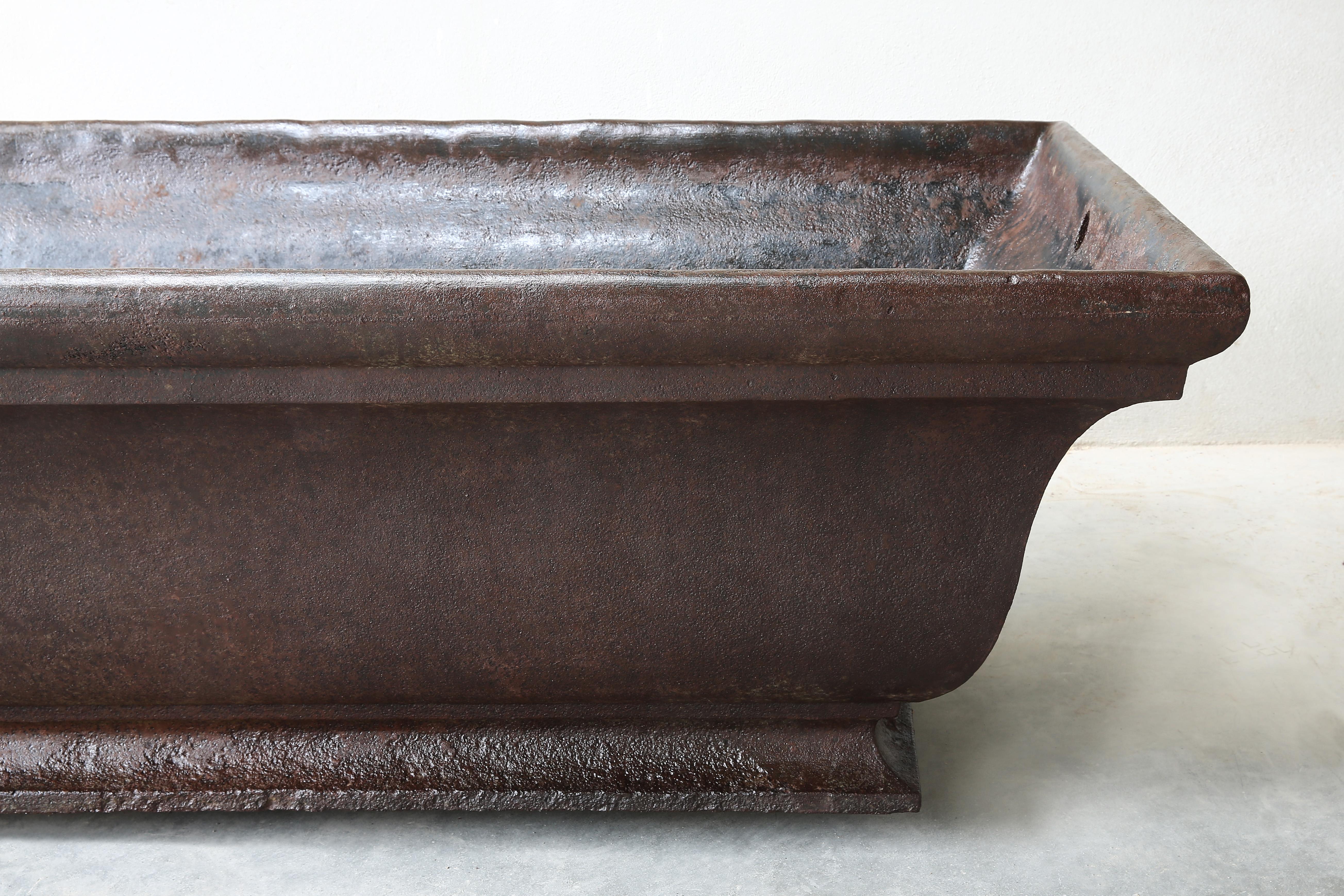 Beautiful antique cast iron drinking trough from 1885. This old French cast iron trough comes from the foundry (fonterie) from Varigney Haute Saone and was formerly used as a drinking bowl that stood at the entrance of the village to welcome people