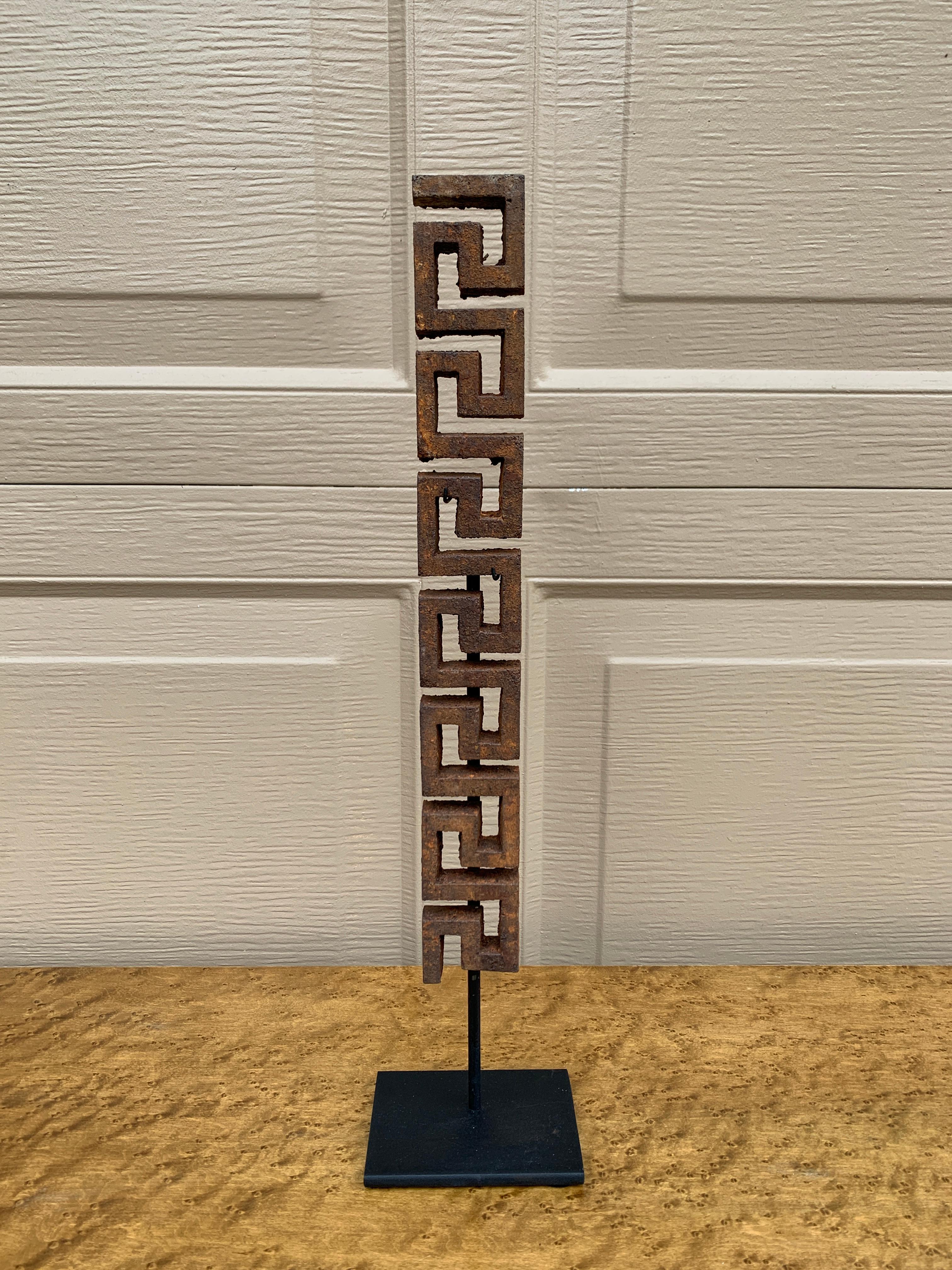 A beautiful antique iron Greek key architectural fragment on a custom black steel mount. 

USA, Early 20th Century

Fragment measures 1.75ʺW × 0.63ʺD × 13.25ʺH 
Mount base measures:  4