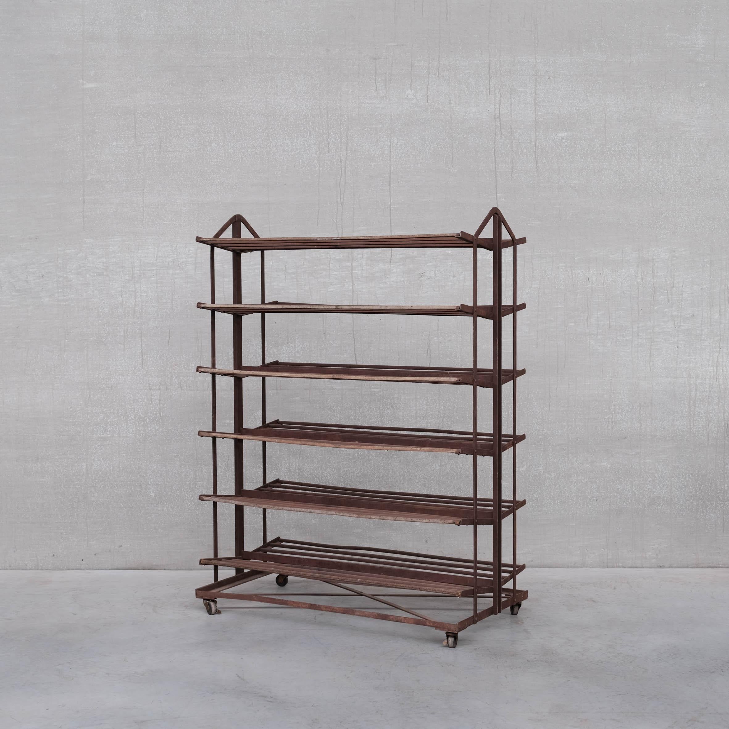 A French early display rack.

France, circa 1930s.

By repute for shoes.

Raised on castors.

Ideal display or shelving display.

Wear and patina commensurate with age.

Location: Belgium Gallery.

Dimensions: 150 H x 110 W x 55 D in