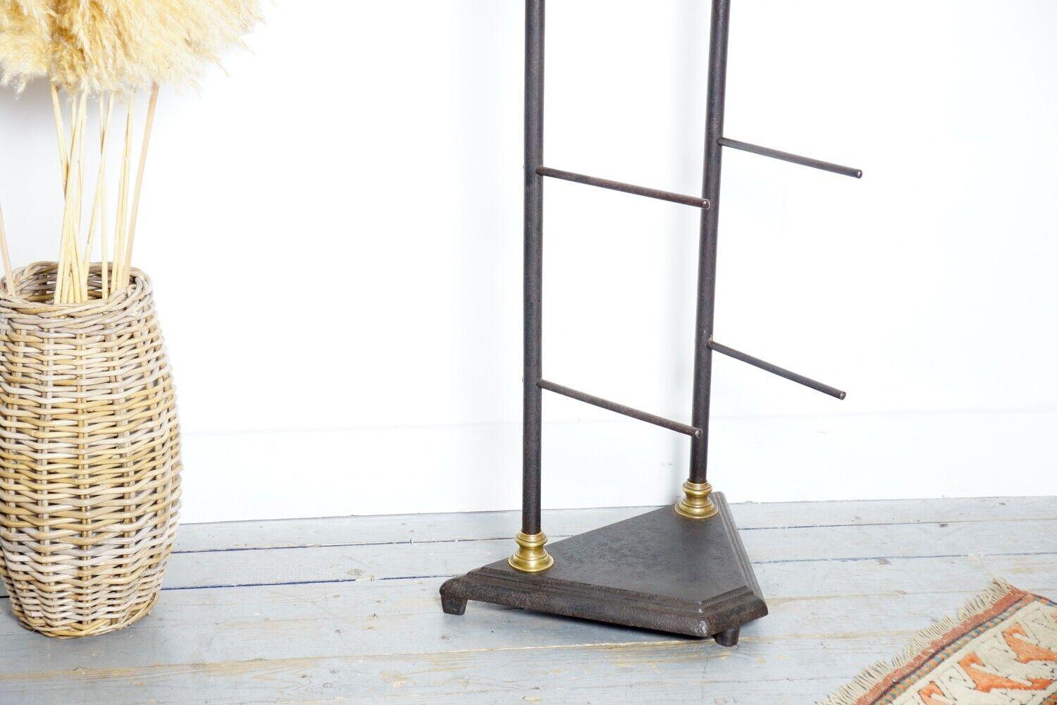 Antique Retail Display Stand

Antique shop Display Stand/Unit on a heavy base

Original late 19th century retail display stand possibly from a bakers. Made from cast iron with ornate cast finials at either end. Both poles sit within a heavy