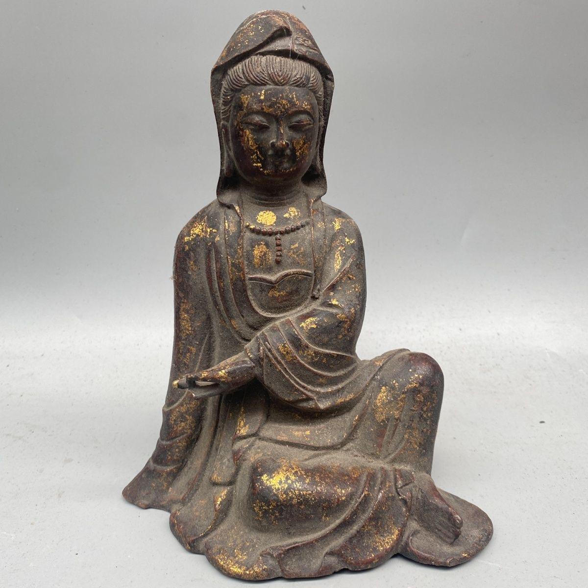 This Old Asian Iron Sitting Buddha Statue is a captivating representation of serenity and spiritual wisdom, featuring the Buddha in a meditative pose with one hand resting on the floor. The iron craftsmanship adds a unique, aged charm to the piece,