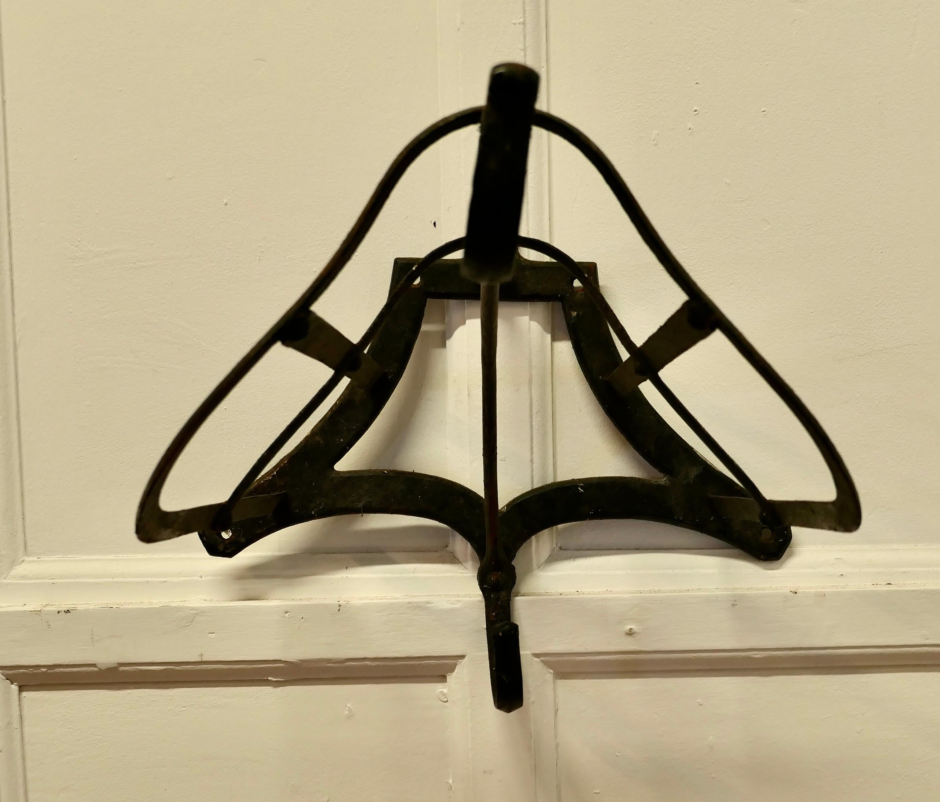 Antique Iron Wall Hanging Saddle Rack

This is a 19th century rack made in Iron, it has an old paint finish and is all in good sound condition
The rack is about 18” long, 15” high and 24” deep
TMS220.