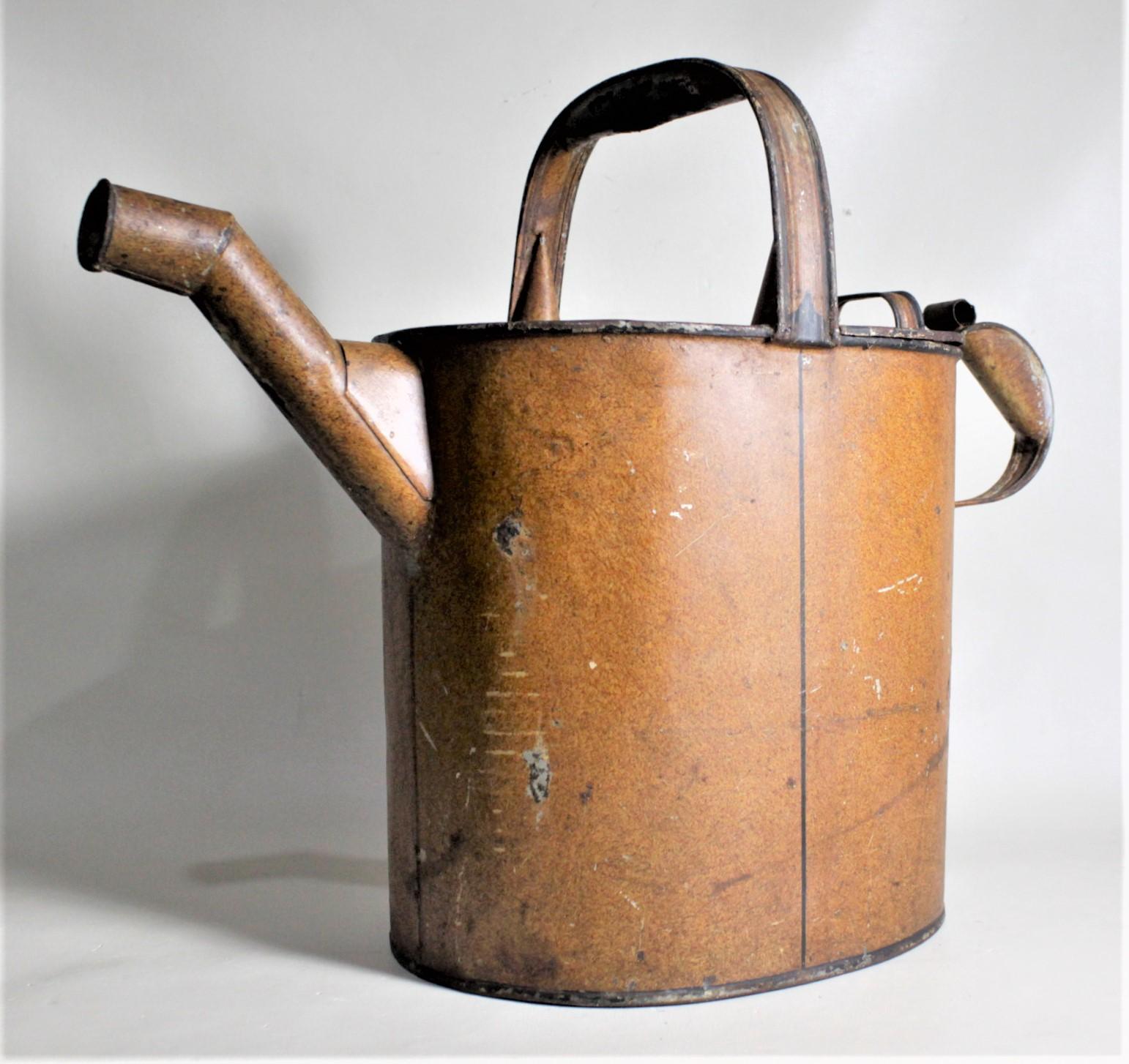 This antique handcrafted water can was made by John Mileuengrav, an Ironmonger from Perth Scotland in circa 1880 in the period Victorian style. This large watering can shaped vessel was made for domestic use in a very affluent home for, most likely,