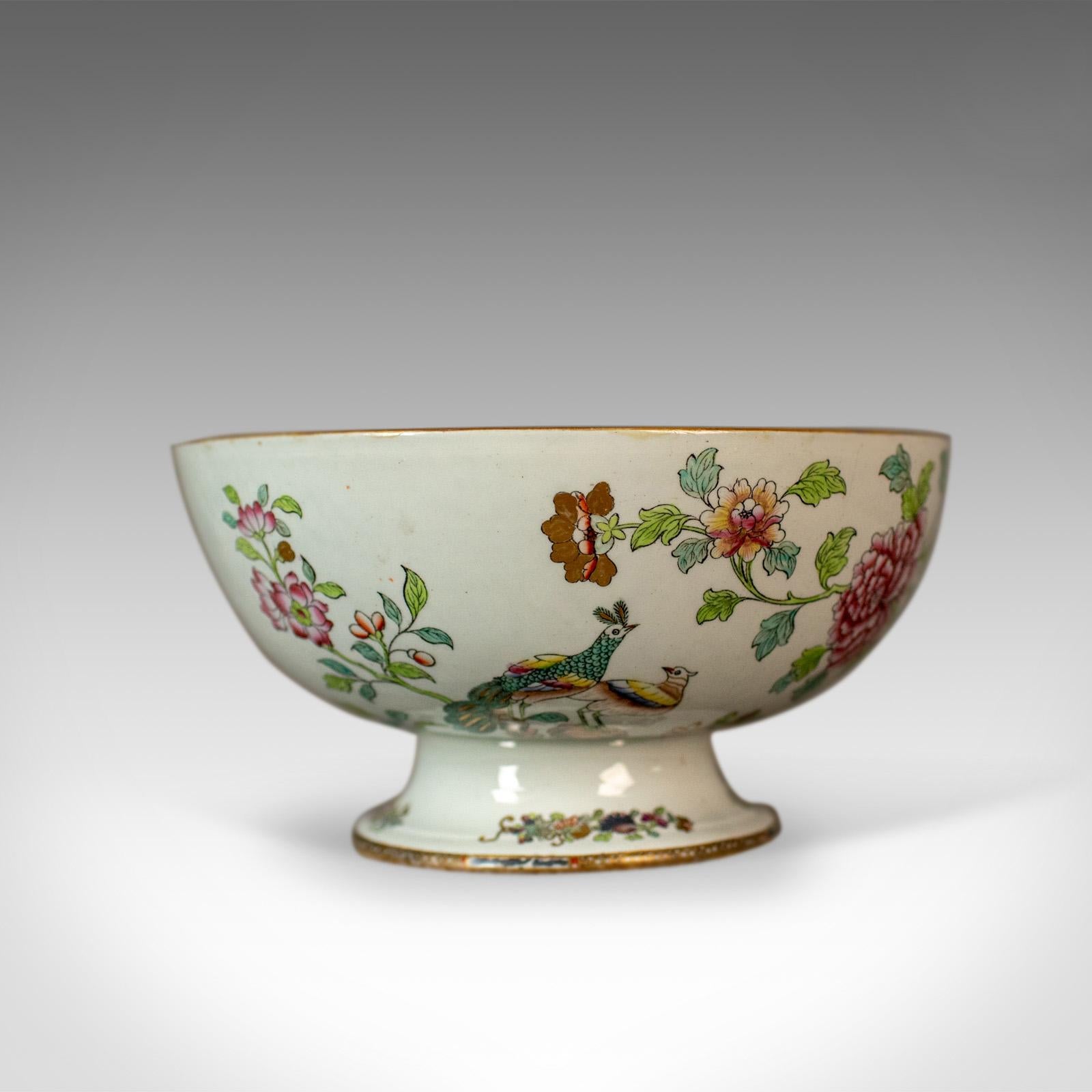 This is an antique ironstone bowl, a 19th century, Victorian, chinoiserie ceramic bowl.

An attractive bowl with a maker's mark to the base
In good condition throughout
Painted with a floral scene and peacocks
Highlighted with gold
The theme