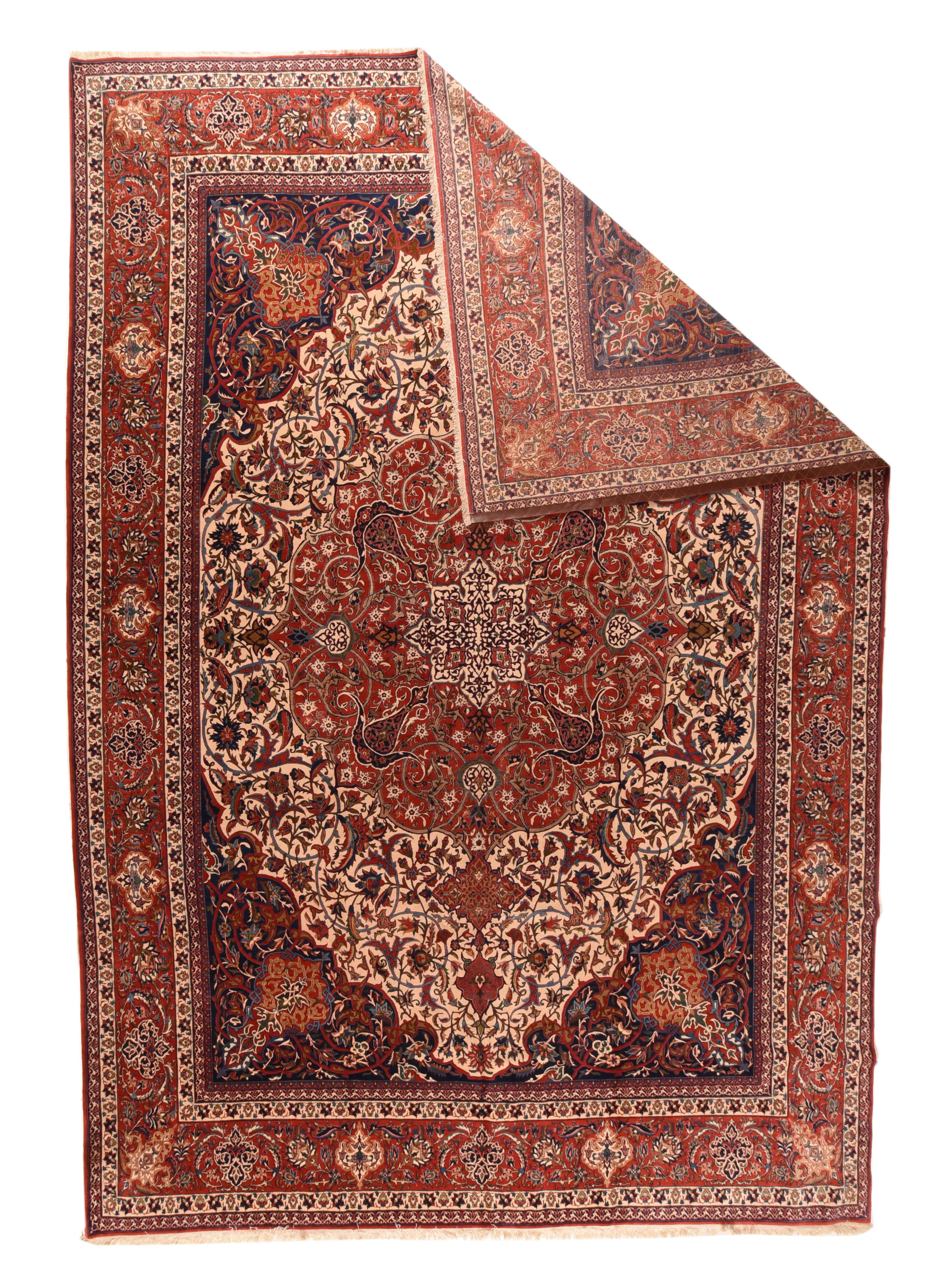 From a central Persian town famous for, as here, extremely fine and perfectly executed carpets, this  example displays a shaped ecru field centring a gently lobed  doubly pendanted red medallion and ivory octogramme sub-medallion. Barbed and forked