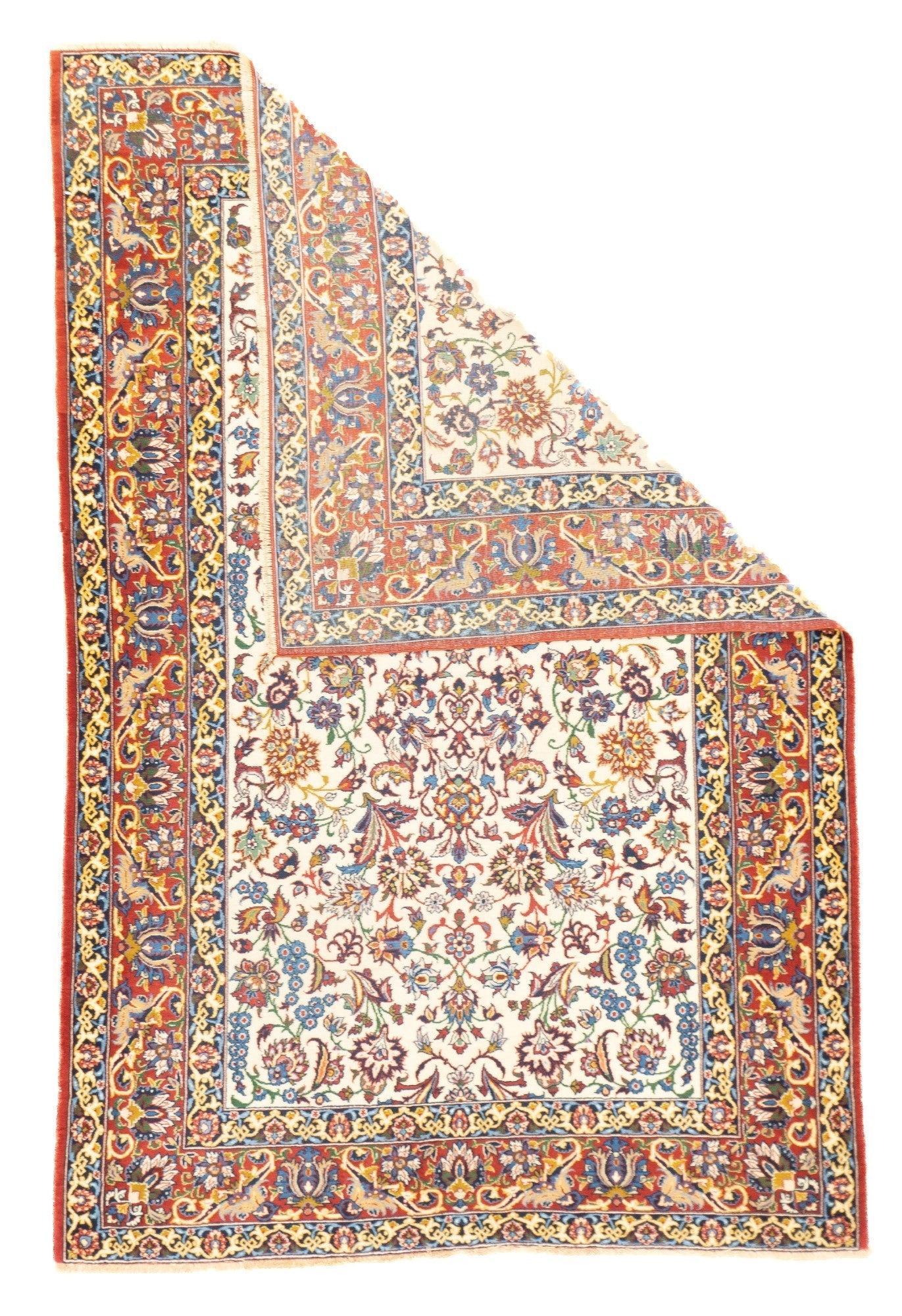 Antique Isfahan Rug 3'5'' x 5'2''.  The ivory field shows a tightly drawn directional pattern of palmettes, leaves and vinery in a multitude of secondary shades. Lipstick red border with vasiform; palmettes and doubly volute long, slanted leaves.