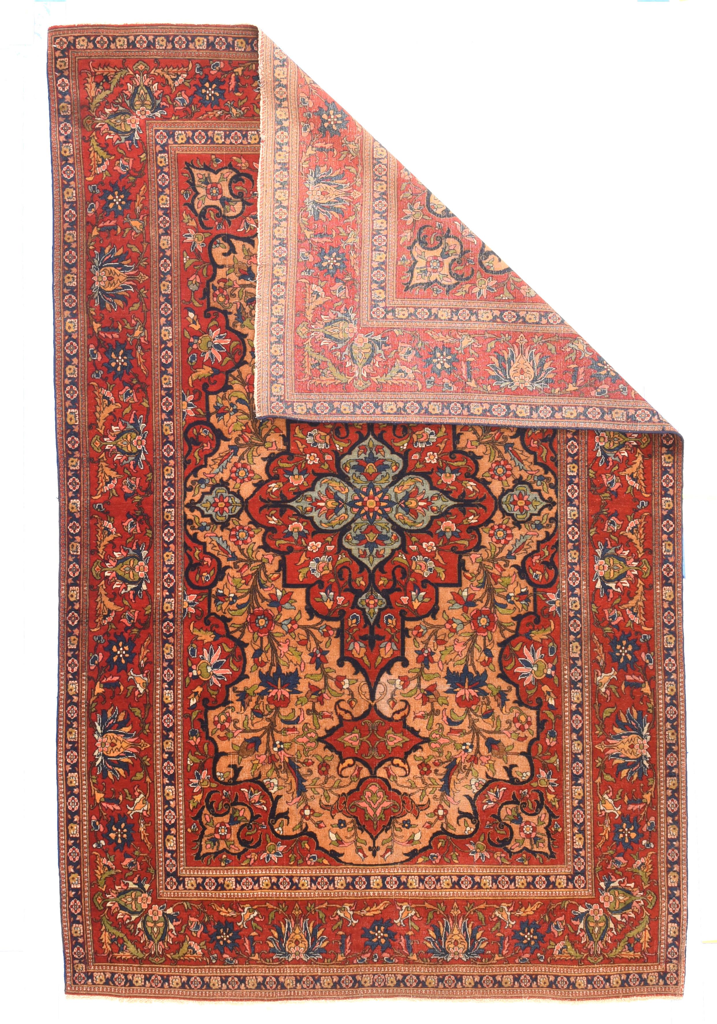 This attractive interThis interwar central Persian scatter shows a red stepped medallion with doubled pendants, based in a pale blue quatrefoil core, with flowering vines symmetrically set all around, and braced by extended red en suite corners. Red