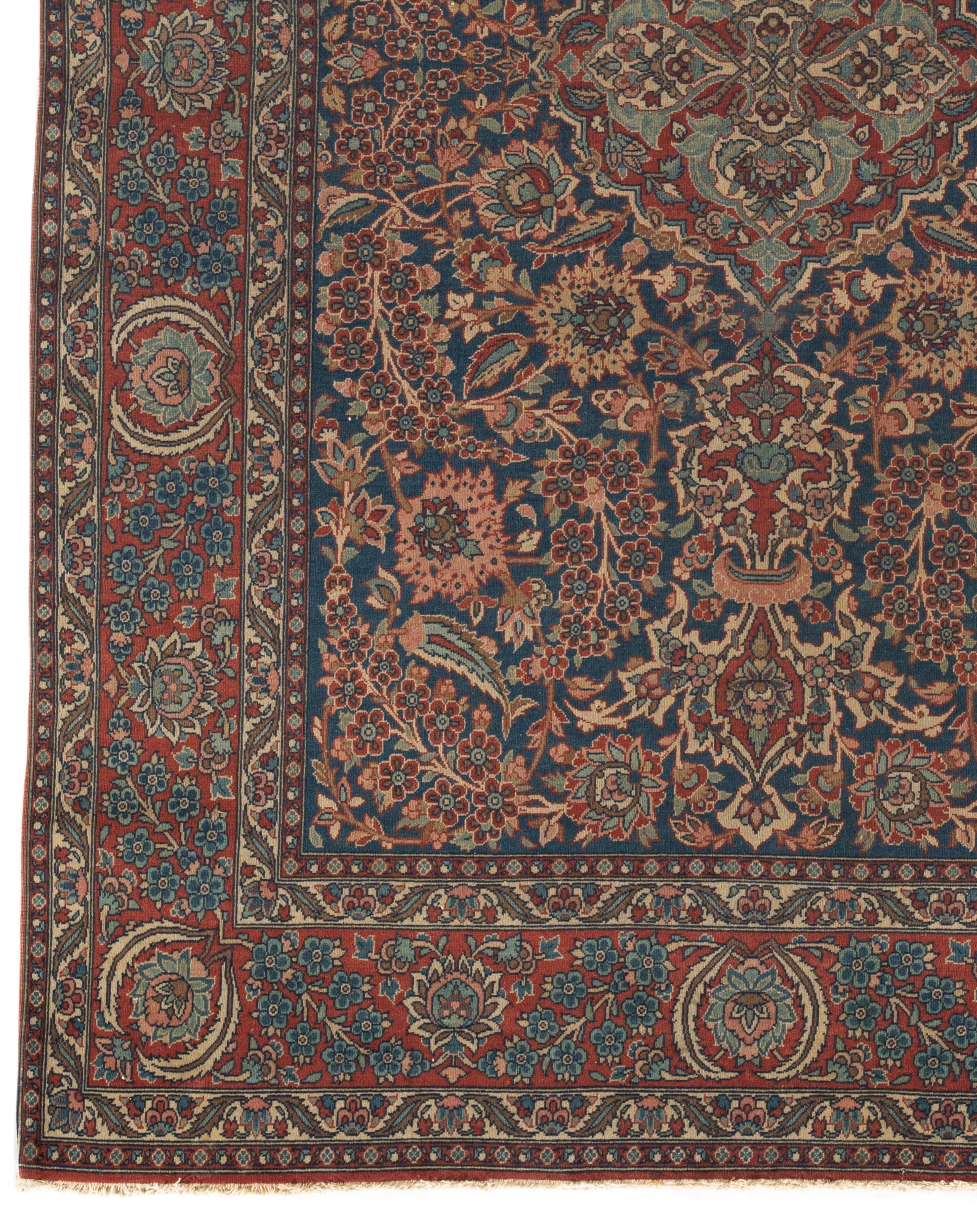 Antique Isfahan rug, circa 1880 . From Isfahan in Persia comes this lovely small rug which has so many wonderful attributes beginning with the fine weaving of the rug composition in the blue main field full of floral designs in a soft blue and rose