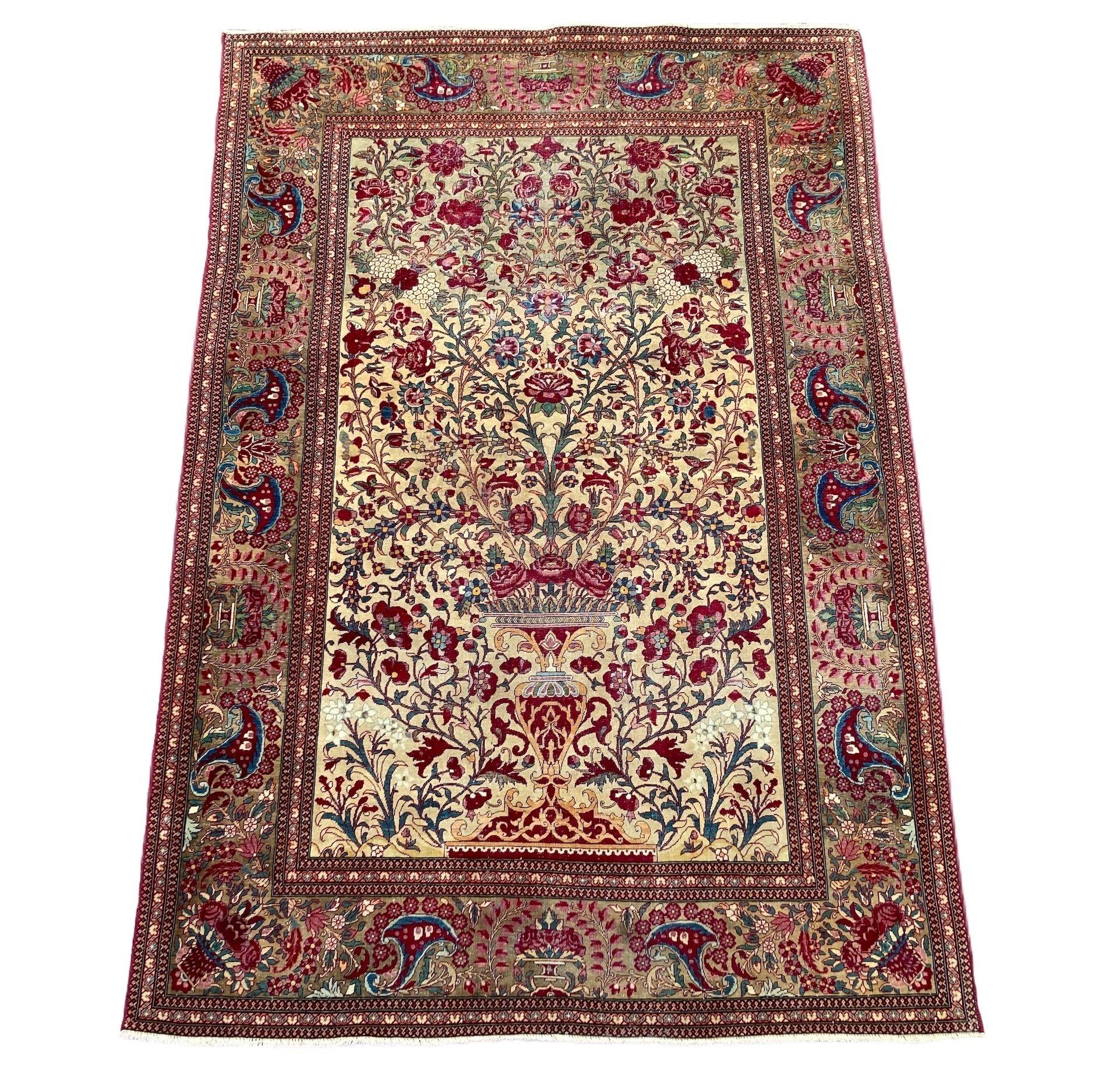 A stunning antique Isfahan rug, hand woven circa 1900 with an elegant vase design on an ivory field and camel border. Finely woven with lovely wool quality and great secondary colours of terracotta, greens and blues.
Size: 2.04m x 1.38m (6ft 8in x