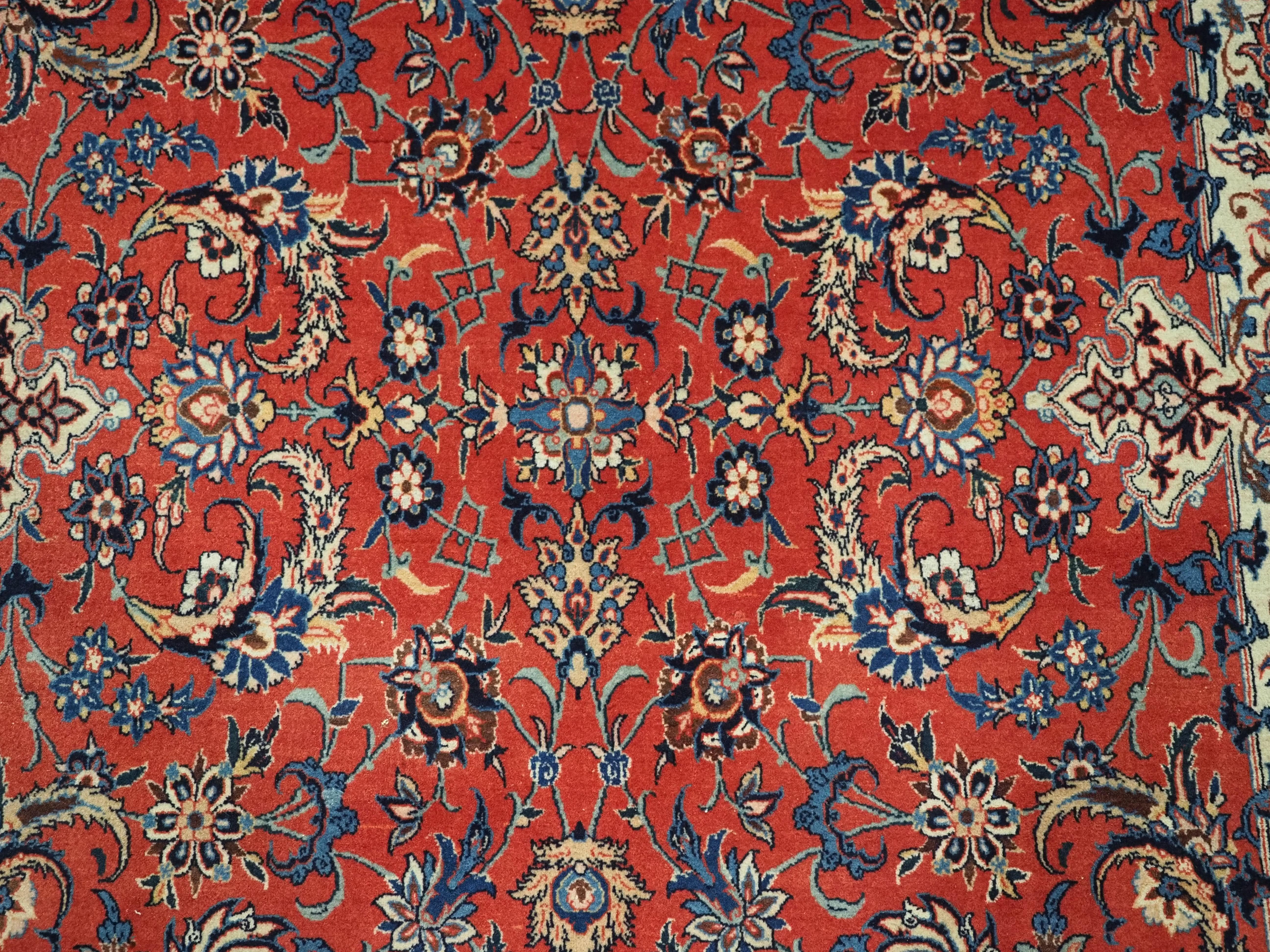 Antique Isfahan rug with all over design on warm red ground, circa 1920. For Sale 4