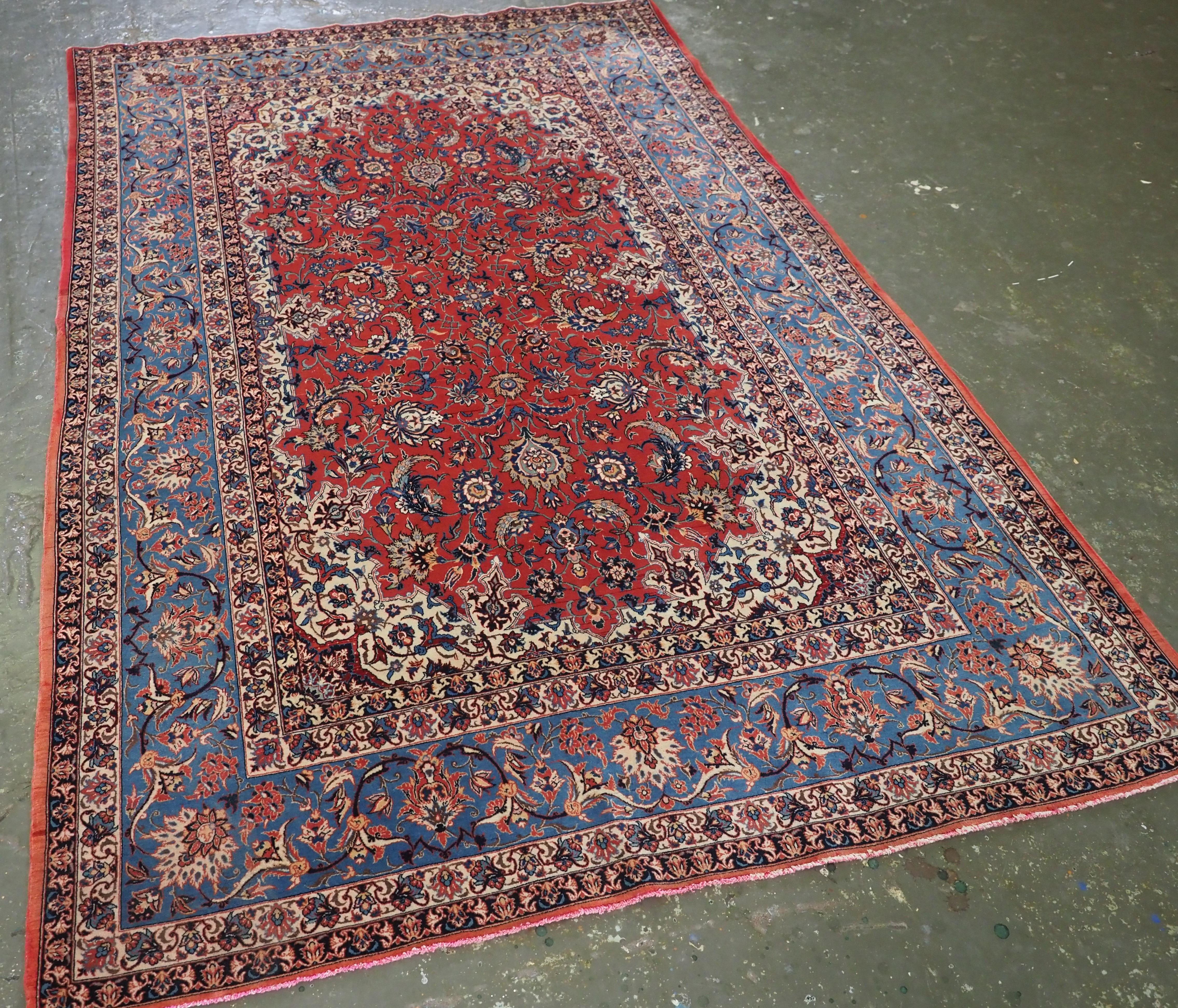 
Size: 7ft 6in x 4ft 10in (228 x 147cm).

Antique Isfahan rug with all over design on an warm red lambs wool ground.

Circa 1920.

The rug is of a very fine weave on a silk foundation, the rug has a floral design to the field, the rug has an overall