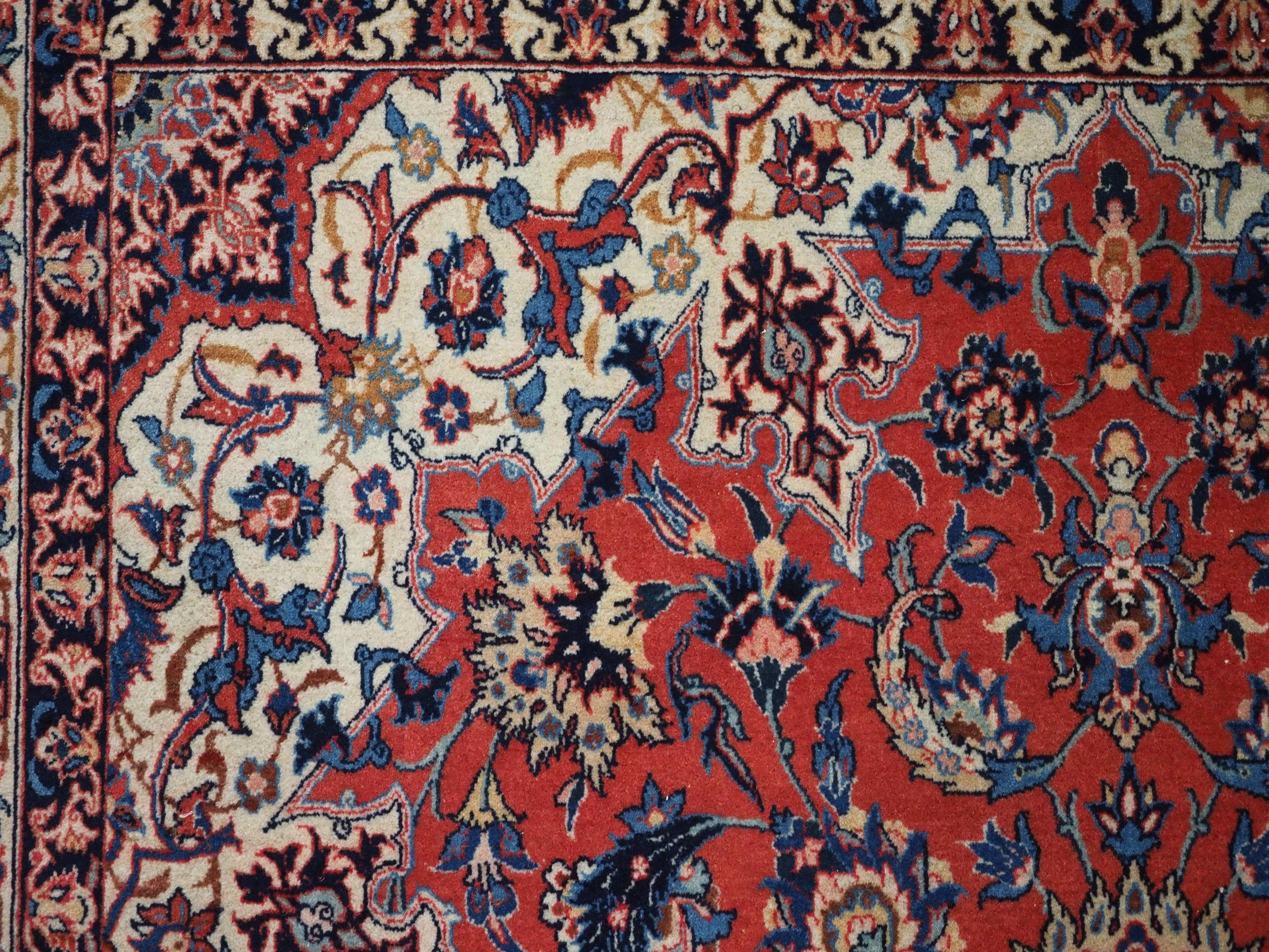 Antique Isfahan rug with all over design on warm red ground, circa 1920. For Sale 2