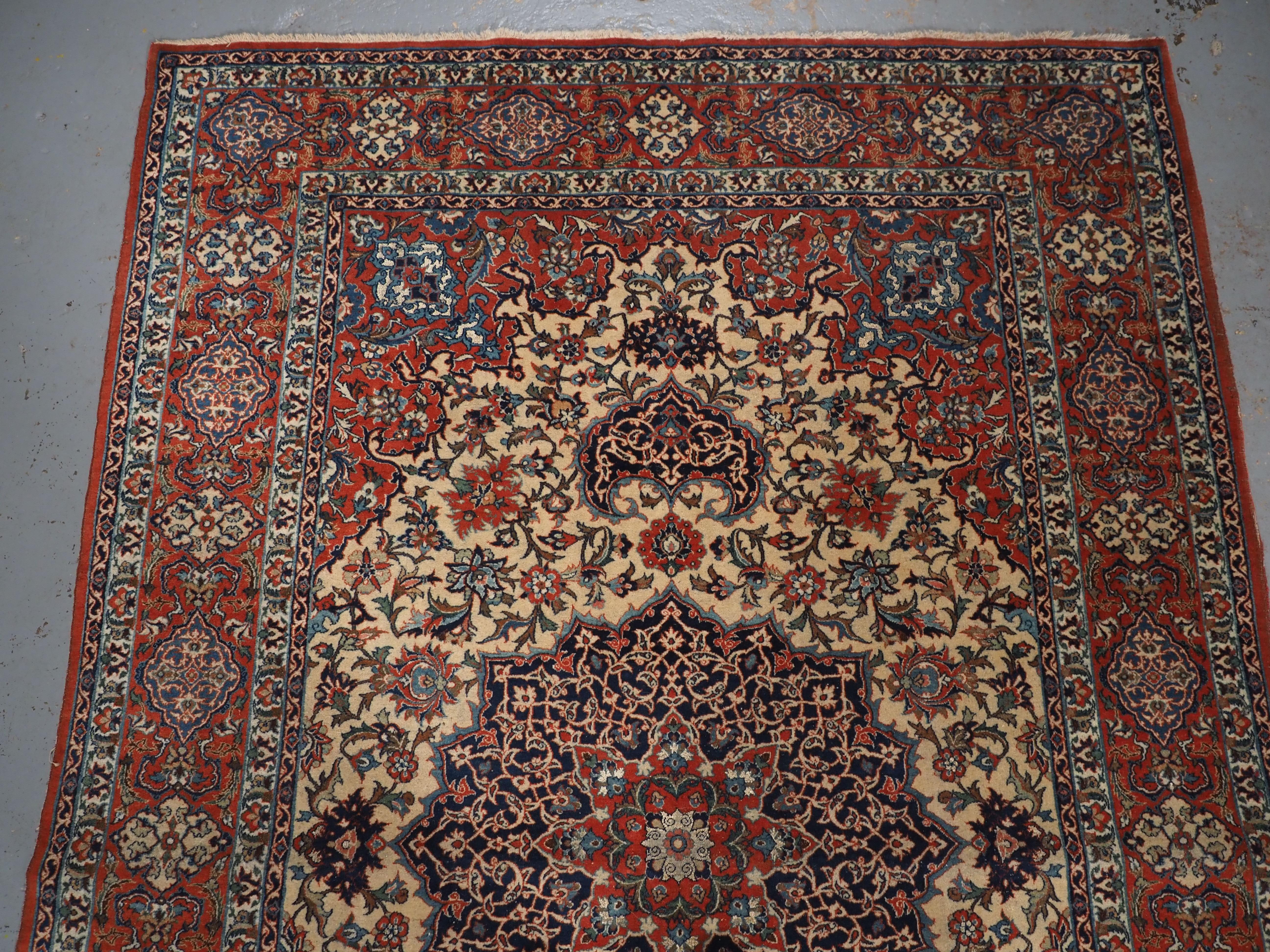 Caucasian Antique Isfahan rug with small medallion design on an ivory ground.  Circa 1920. For Sale