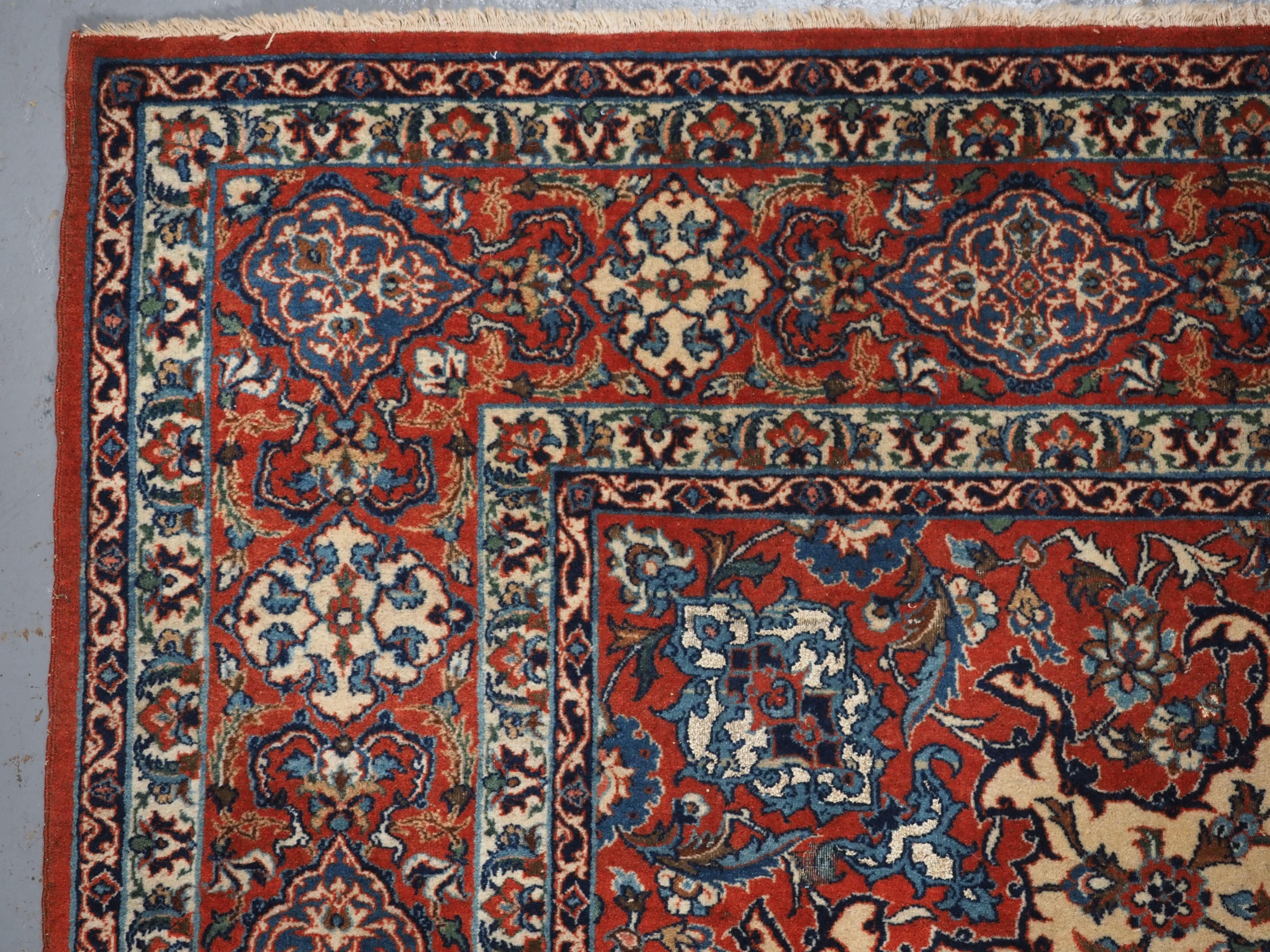 Wool Antique Isfahan rug with small medallion design on an ivory ground.  Circa 1920. For Sale