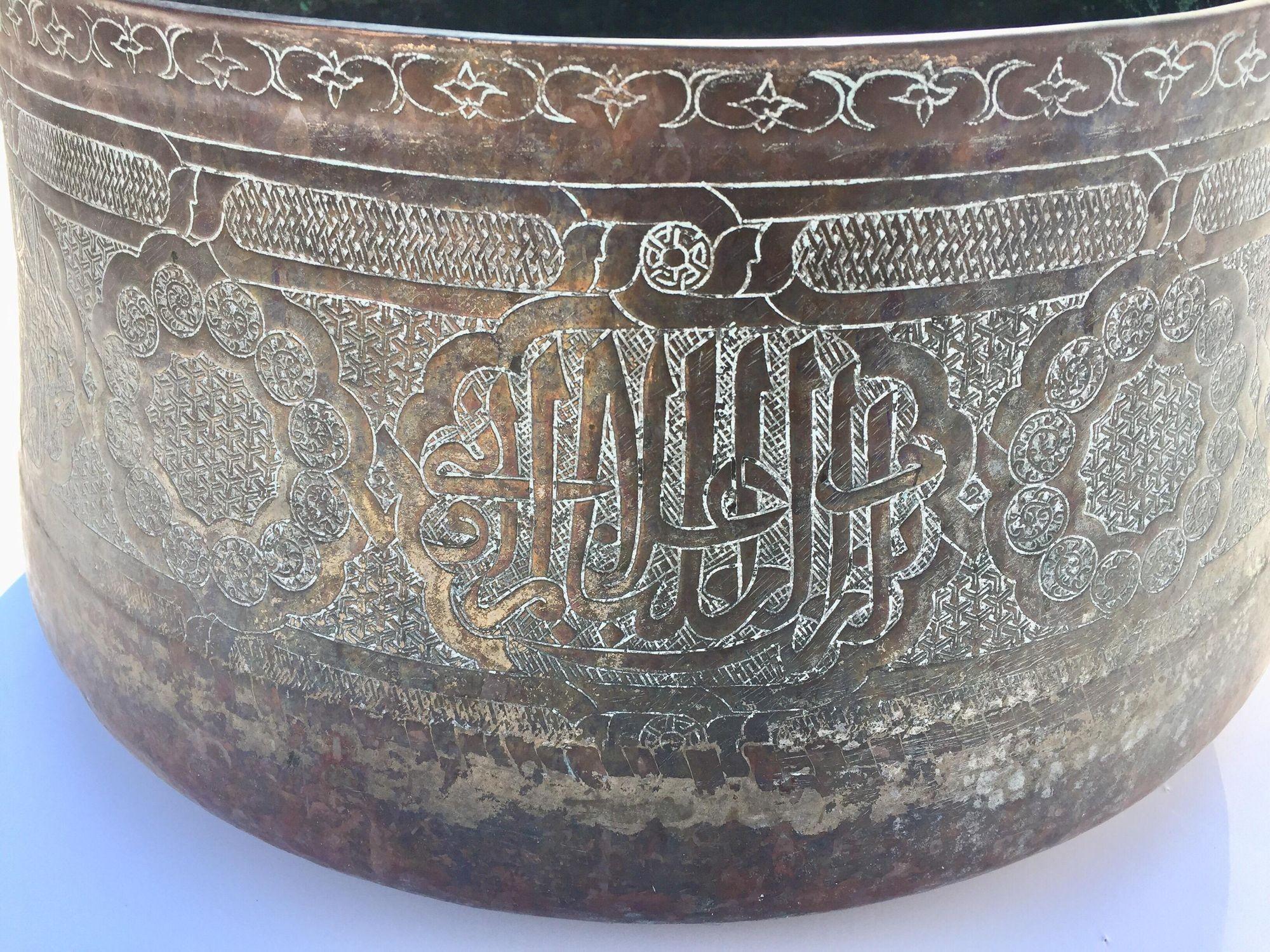 Large antique Islamic 19th century Middle Eastern Moorish hand-etched tined copper brass bowl, 17 inches diameter.Could be used as a jardinière for a large orchids composition.With rounded base and sloping inverted sides leading to a thickened rim,