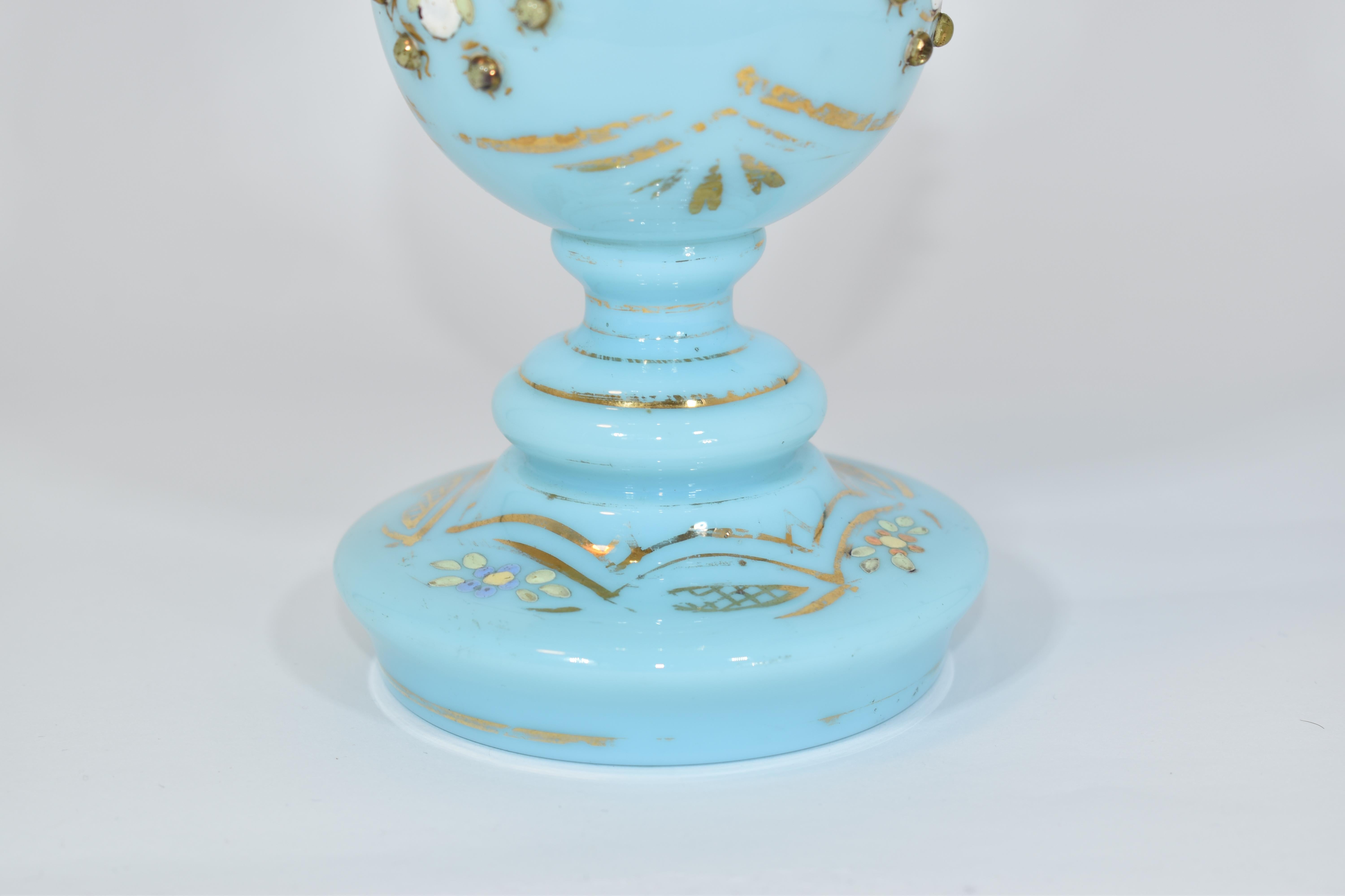 Antique Turquoise Opaline Glass Rose Water Sprinkler

Decorated with colorful enamel and gilding highlights and applied with enamel beads
Fine example of high quality European glass made for the Islamic market in the 19th century.