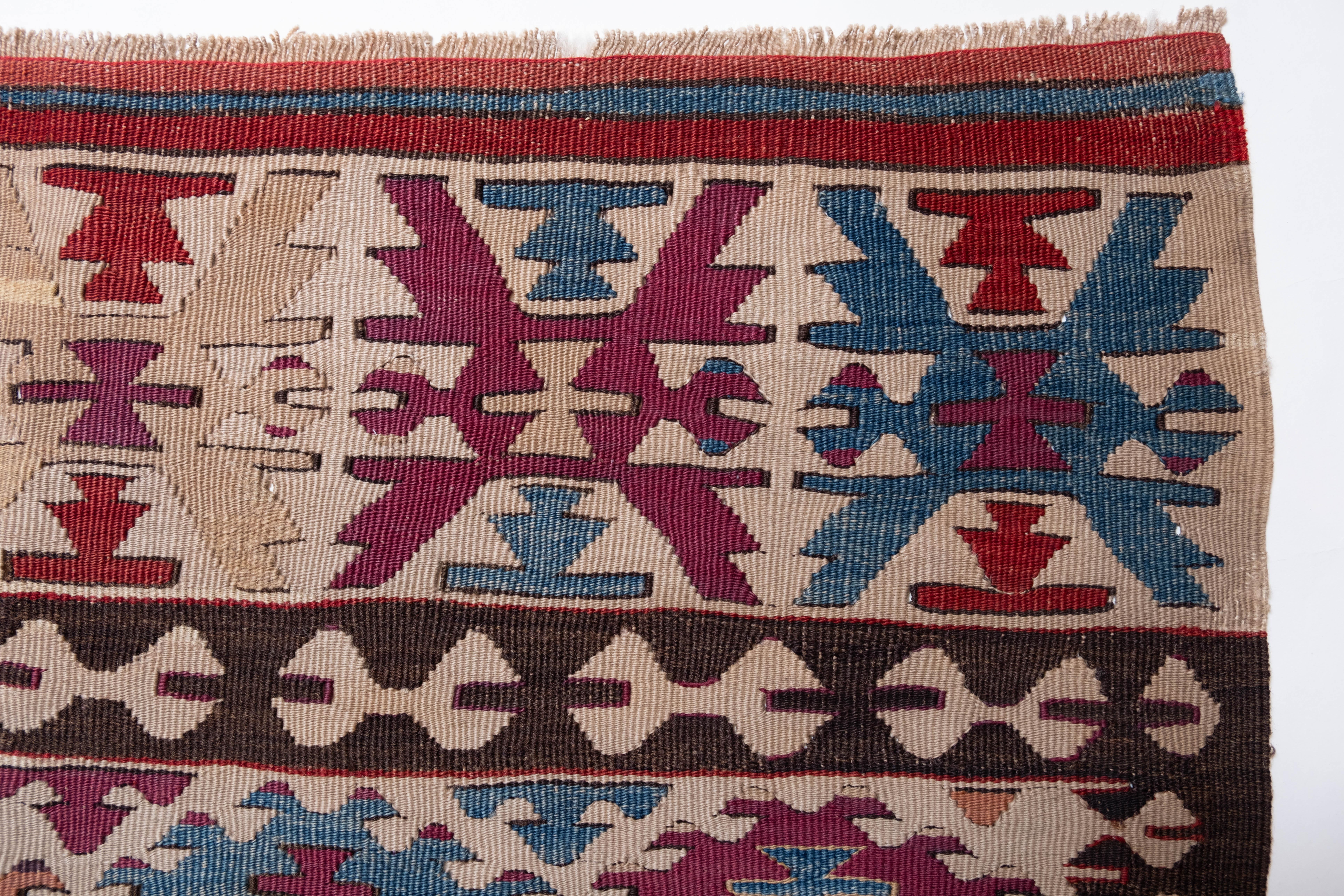 This is Central Anatolian Antique Kilim, from the Isparta region with a rare and beautiful color composition.

This highly collectible antique kilim has wonderful special colors and textures that are typical of an old kilim in good condition. It is