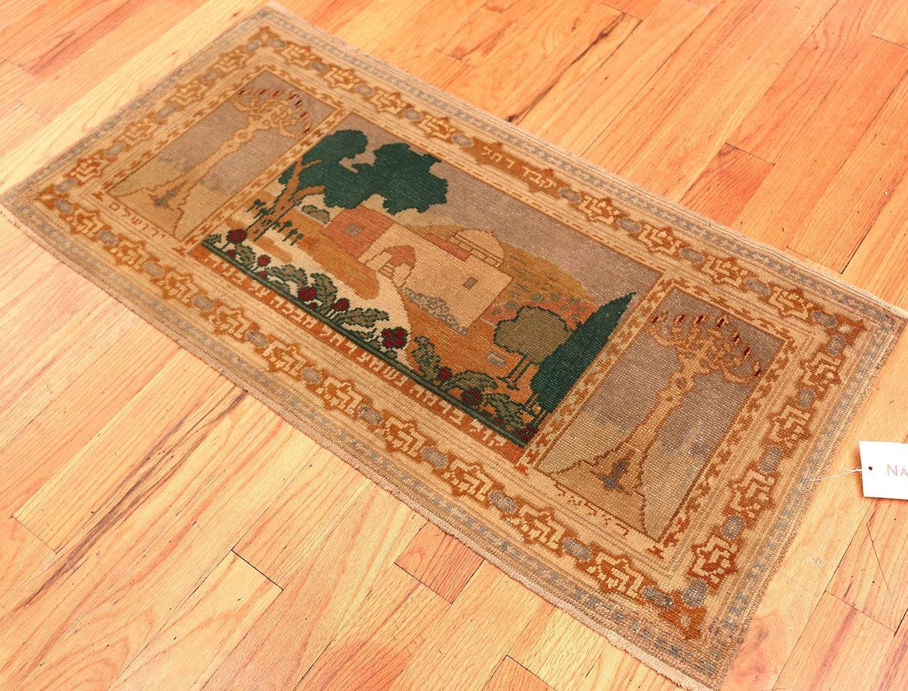 A magnificently artistic antique Israeli pictorial Bezalel Rachel’s tomb rug, country of origin / rugs type: antique Israeli rugs, circa 1920. Size: 3 ft 9 in x 2 ft 5 in (1.14 m x 0.74 m)

This antique Israeli Bezalel rug was produced in the 1920’s