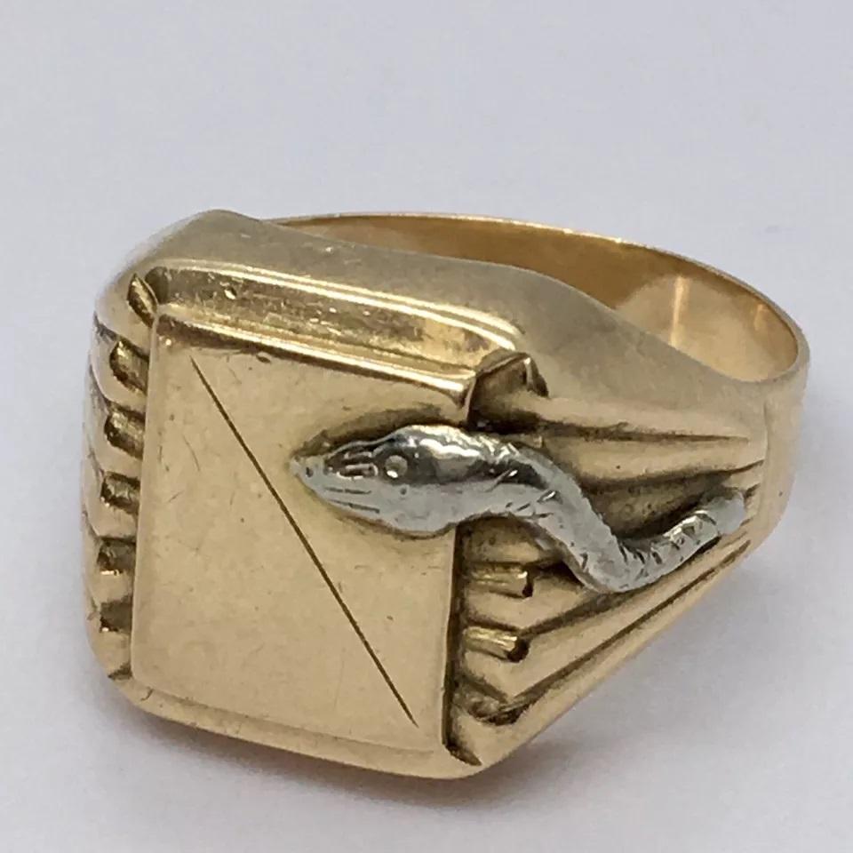 Antique Italian 18K GOLD Serpent SIgnet RIng 8.2 Gram Size 11.5 No Engraving

This antique Italian ring features a stunning 18K gold serpent signet, with a beautiful engraved design. The ring is a size 11.5 and weighs 8.2 grams, making it a perfect