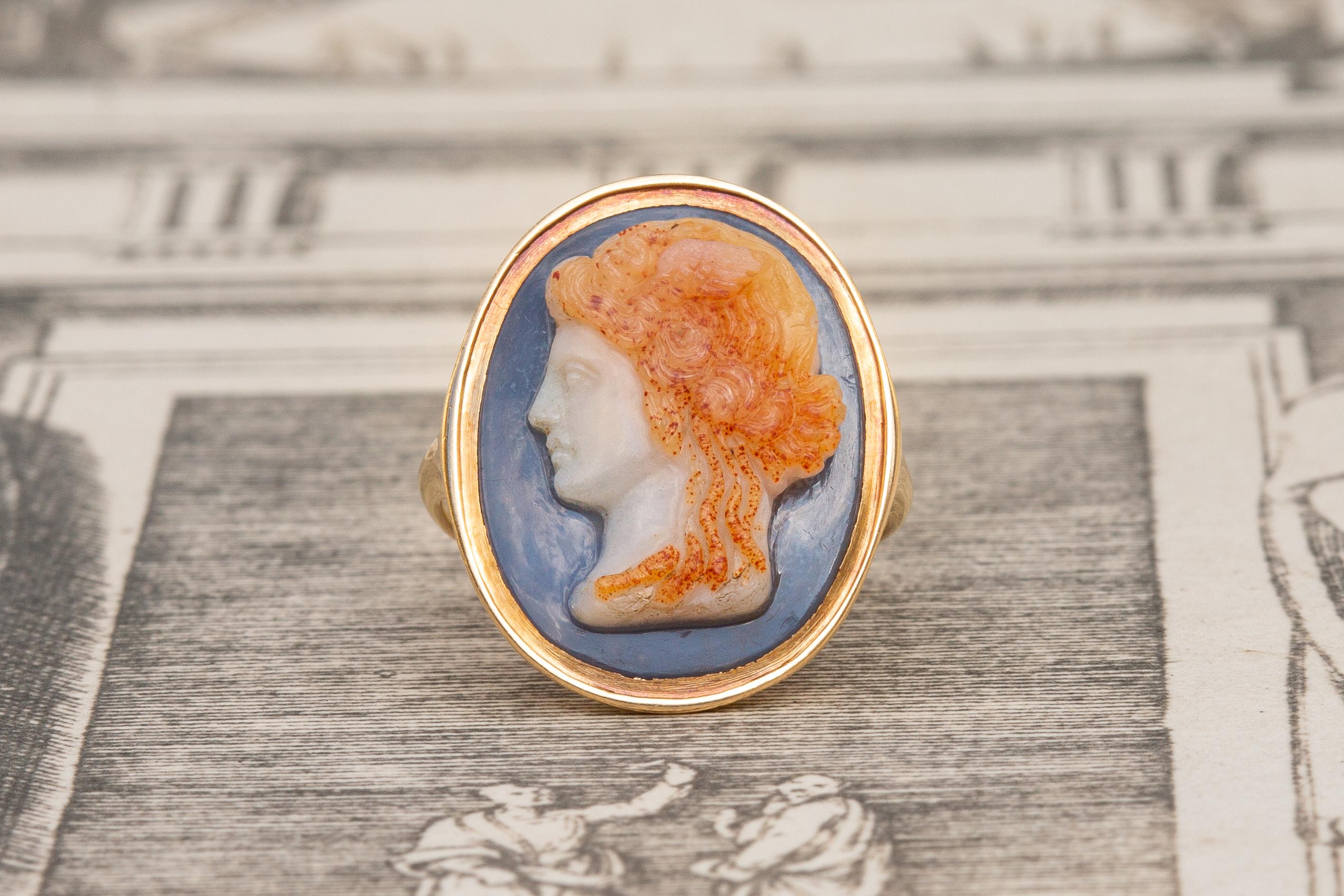A gorgeous 18th century Italian hardstone cameo ring. This beautiful four layered sardonyx cameo is carved from a single piece of agate with immense skill to reveal the bust of the Gorgon Medusa in classical style. Classical and Hellenistic