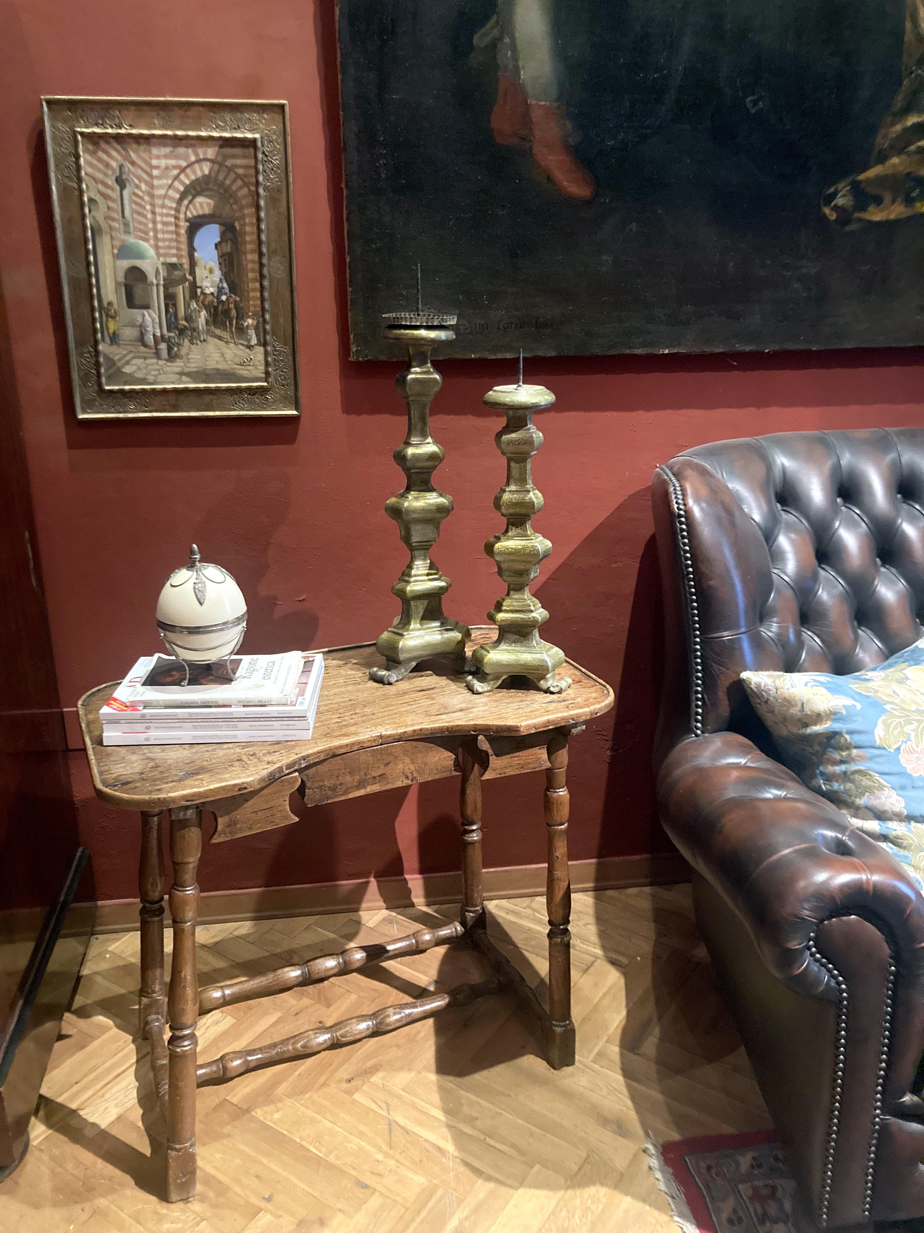 This antique Italian baroque period rustic table dating back to early 18th century all hand cut and carved boasts a lovely shape, great proportions and convenient size. This organic table's aesthetic expresses simplicity, humbleness, and being in