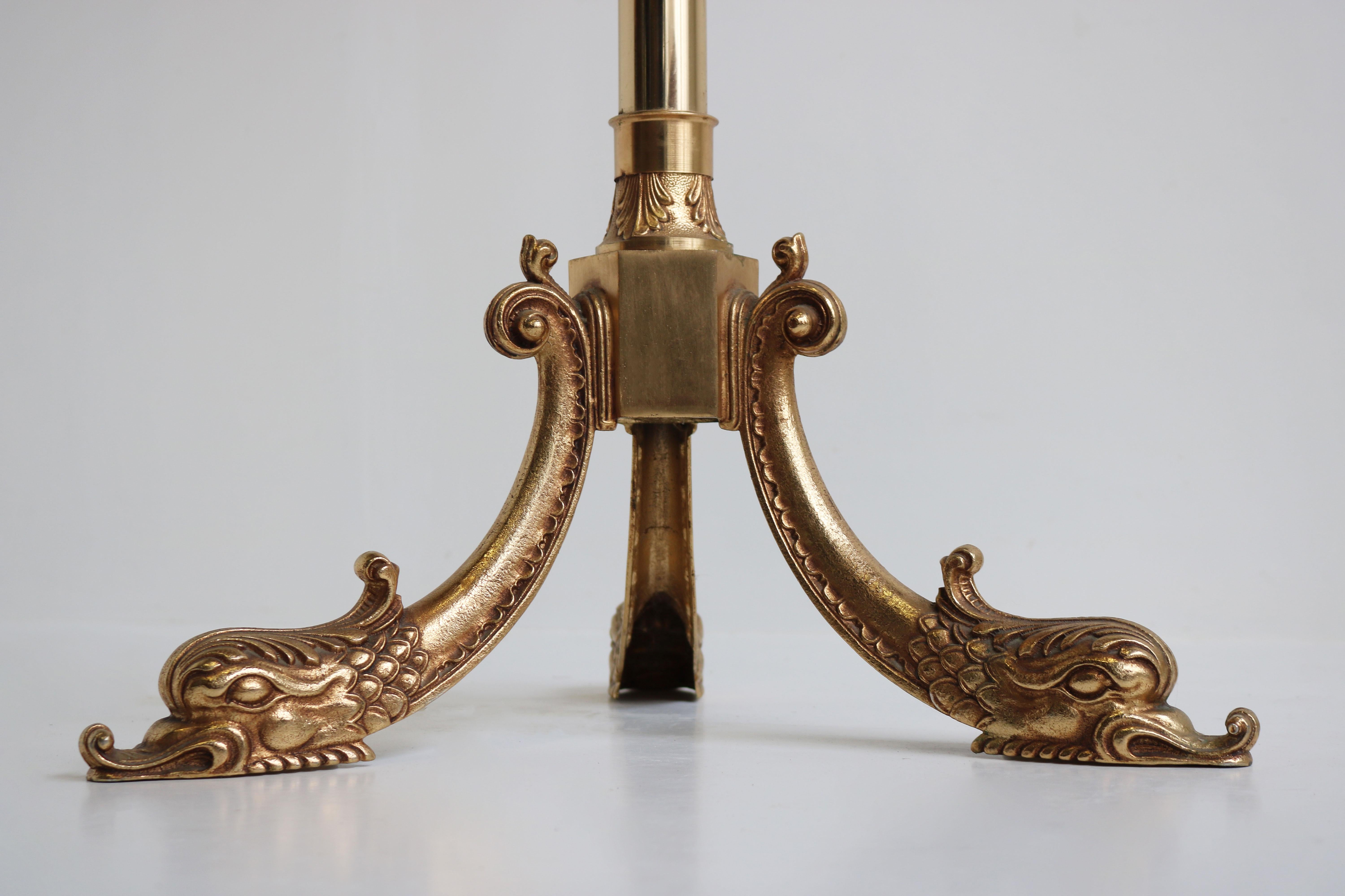 Impressive & practical! This marvelous Italian ornate brass coat rack with Dolphin base from the 1940s. 
Marvelous classical design with impressive gilt brass patina. 
Very nice sturdy quality with amazing details at the top , middle & styled