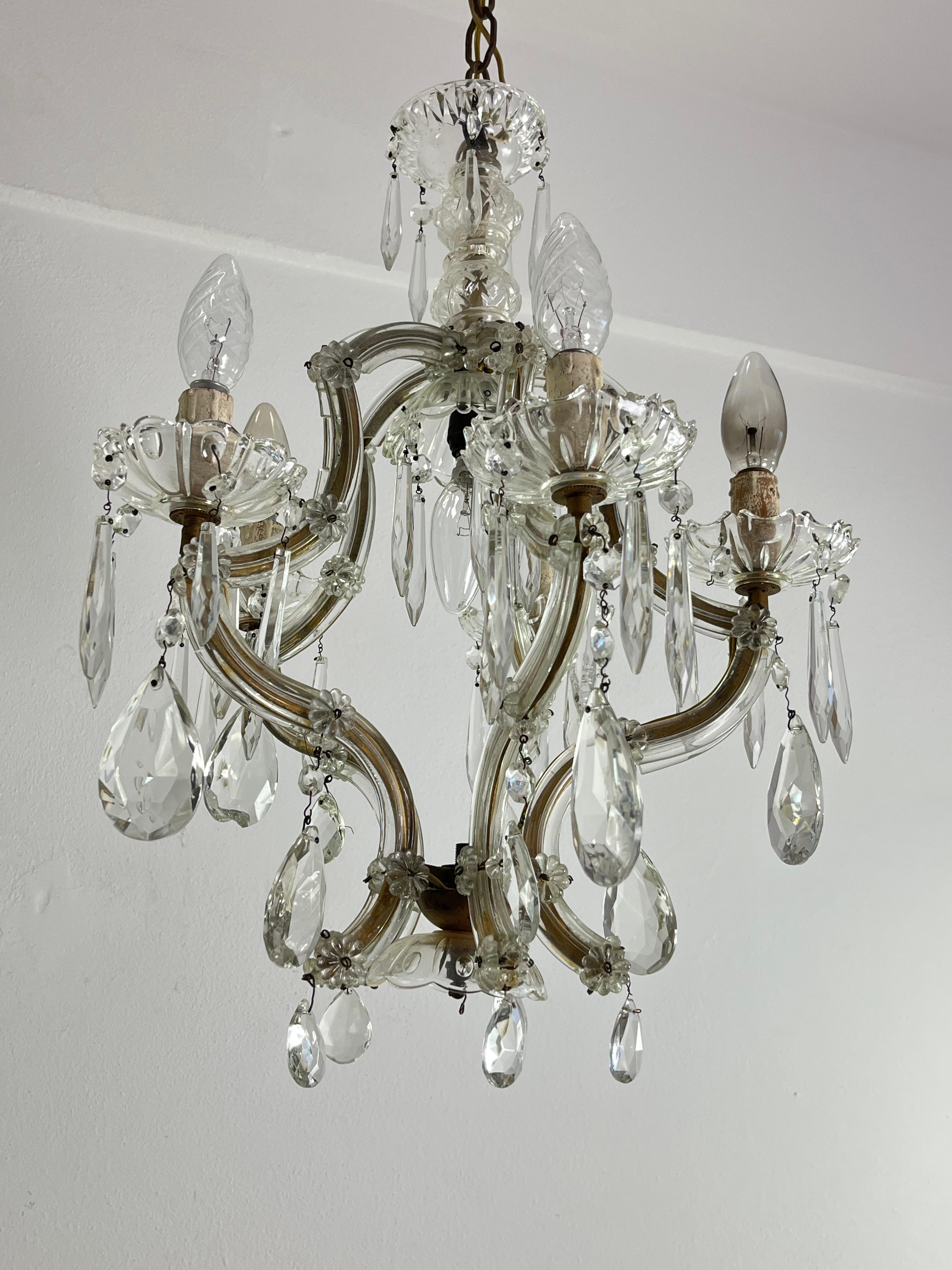 Antique Italian 5-light Mid-Century crystal chandelier, 1950s
Good condition, some crystals are missing and some have cracks.
Height 55 cm of the chandelier alone (100 cm including the chain).
Diameter 41 cm.