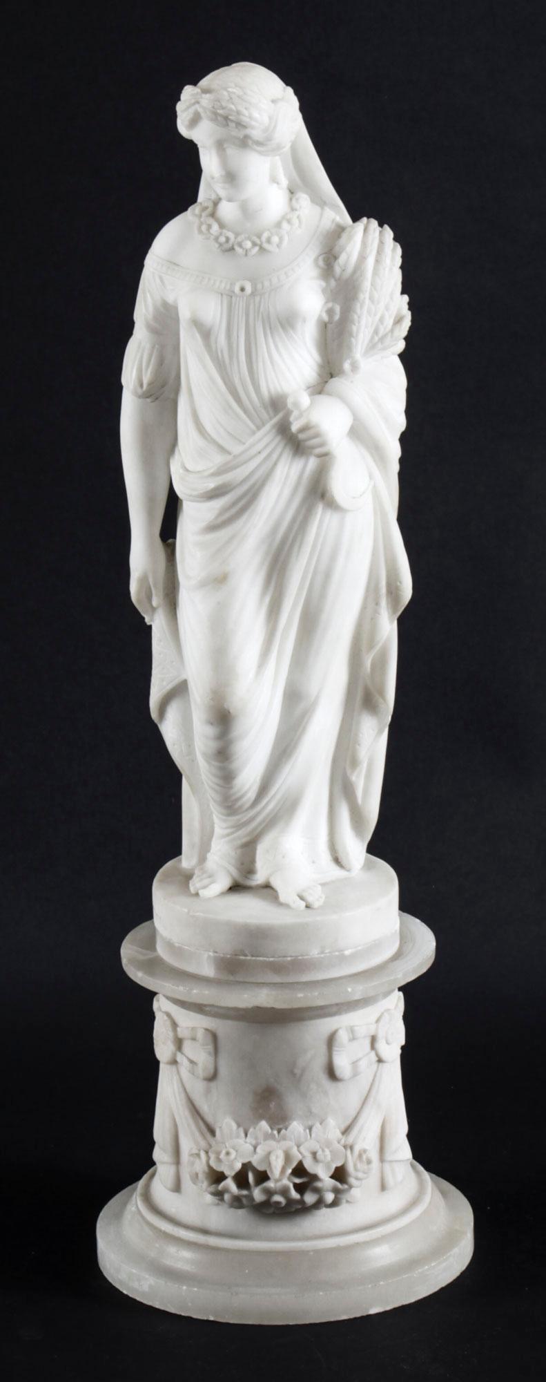 This is a splendid antique Italian carved alabaster sculpture of the goddess Demeter dressed in classical costume, circa 1880 in date. 

This finely carved sculpture depicts a beautiful young Goddess, clothed in a classical robe, she is