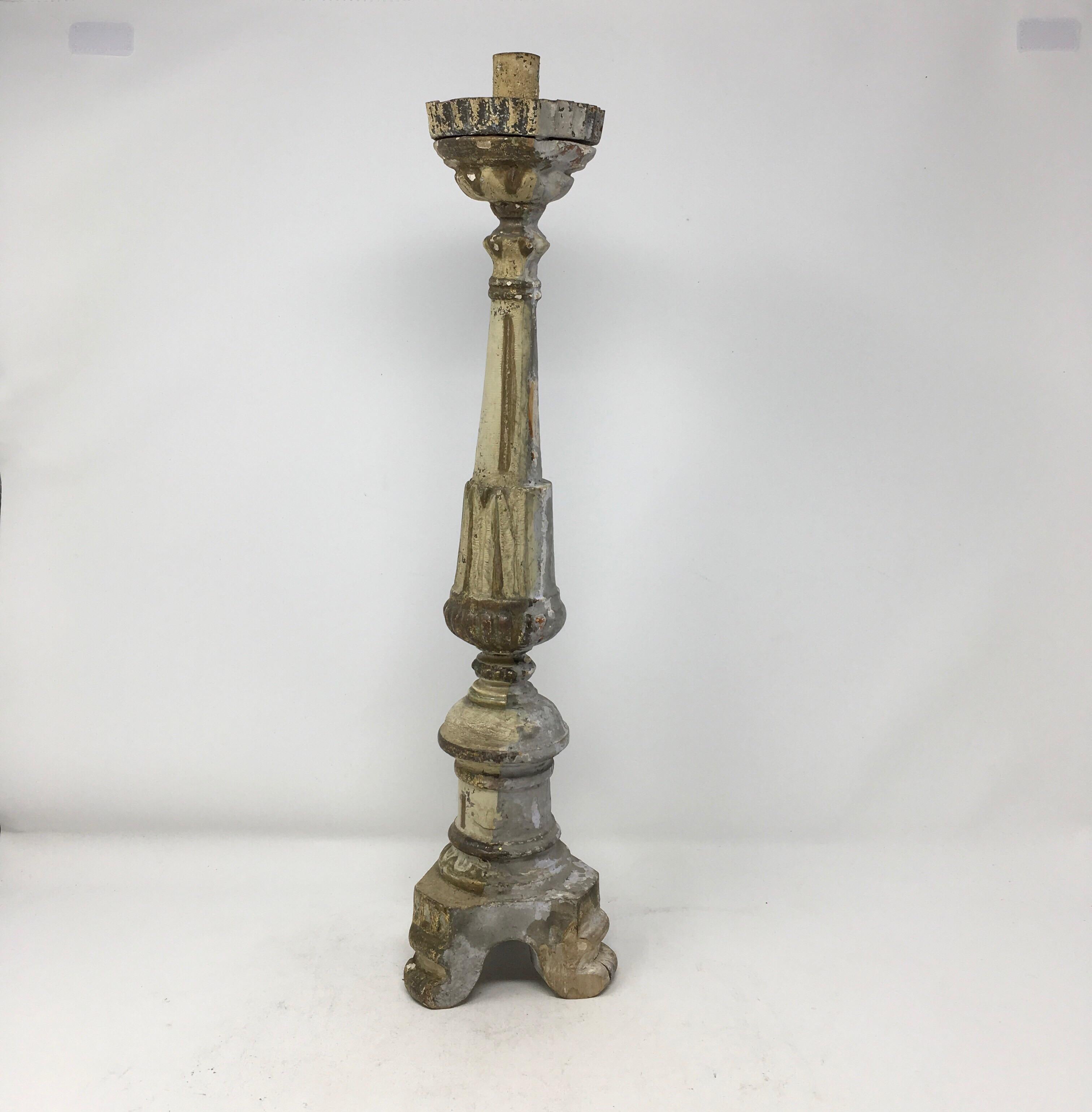 Italian late 18th-early 19th century altarstick. The central column is carved and raised on a tripod base. The top of this altarstick is metal and made to receive candles.