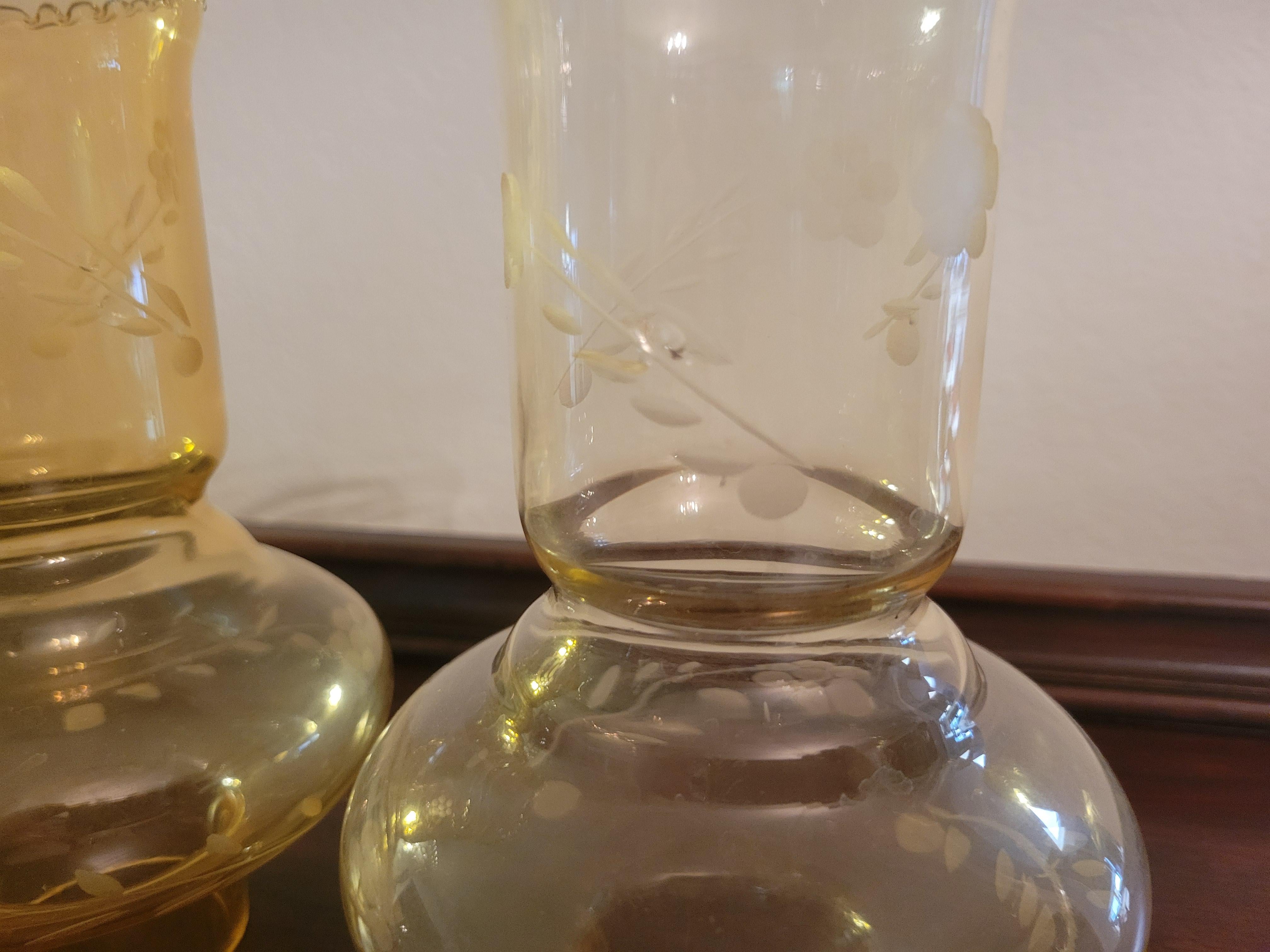 A set of (3) antique amber glass hurricane shades. The color veries a little bit and one of the shades looks a little darker. Though all three are identical in size and design. 
The hight of each shade is 7.2