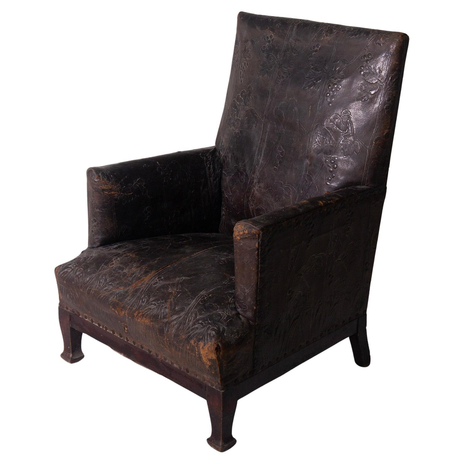 Antique Italian Art Nouveau leather armchair with floral decorations For Sale
