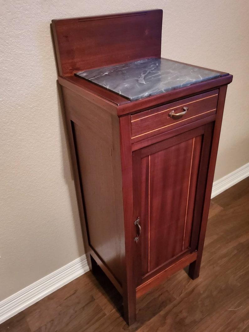 A moderately restored, attractive, period Italian Art Nouveau mahogany bedside cabinet. 

Handcrafted in northern Italy at the turn of the 19th - early 20th century, featuring good quality solid wood construction, with beautiful deep red mahogany