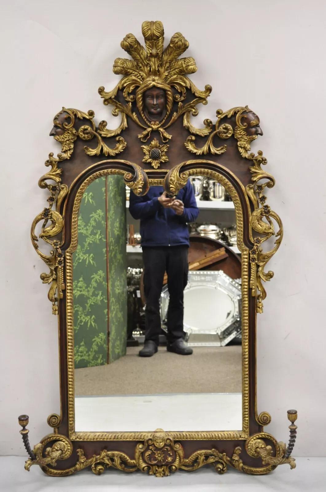 Antique Italian Baroque Figural Mahogany Giltwood Large Wall Mirror with faces. Item features removable carved candlestick sconces (see pic 10), finely carved faces and eagles throughout, scrolling plumed carved headdress to pediment, distressed