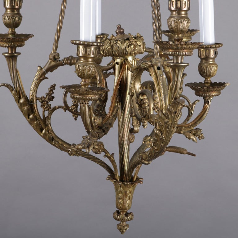 Antique Italian Baroque Gilt Bronze 6 Candle Light Foliate Form Antique Italian Baroque Style Chandelier Features Gilt Bronze Foliate Form Frame With Scroll Arms Terminating In
