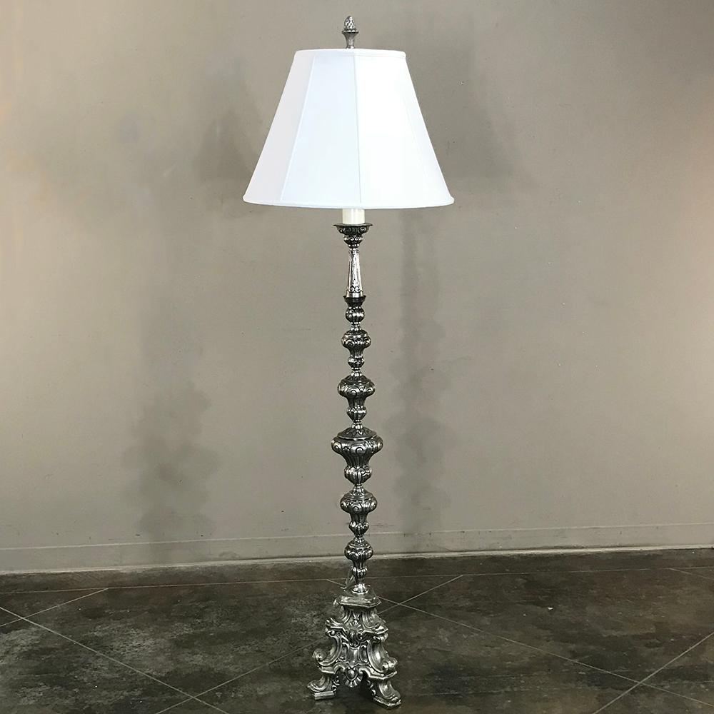 Antique Italian Baroque silver plated brass floor lamp makes a great choice for a corner or seating group. Intricate baroque styling creates a visual feast for the eyes, thanks to the hand-crafted repose work in the brass that is enhanced by the