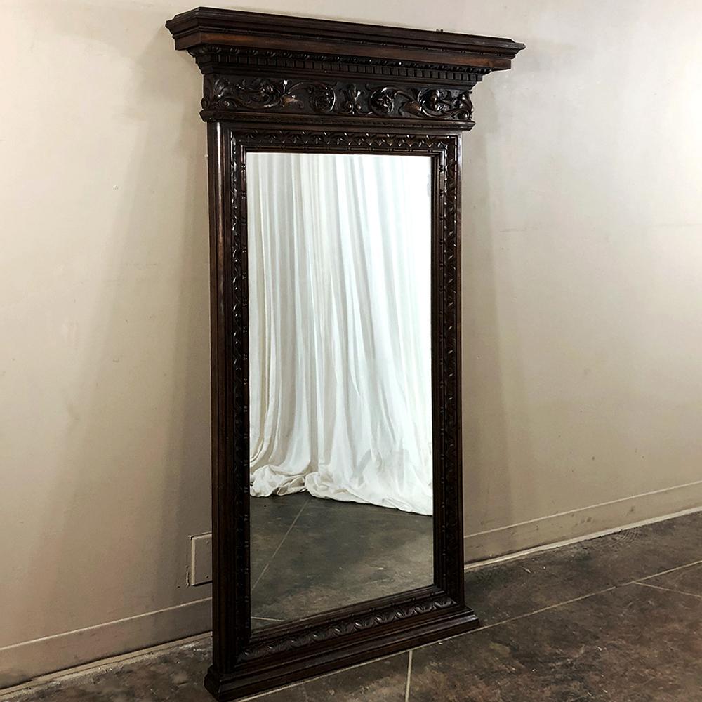 Antique Italian Baroque Walnut Mirror is a splendid example of the genre, and can be used to decorate any room. The design features bold molding detail across the impressive crown above. The entire framework including the magnificently carved crown