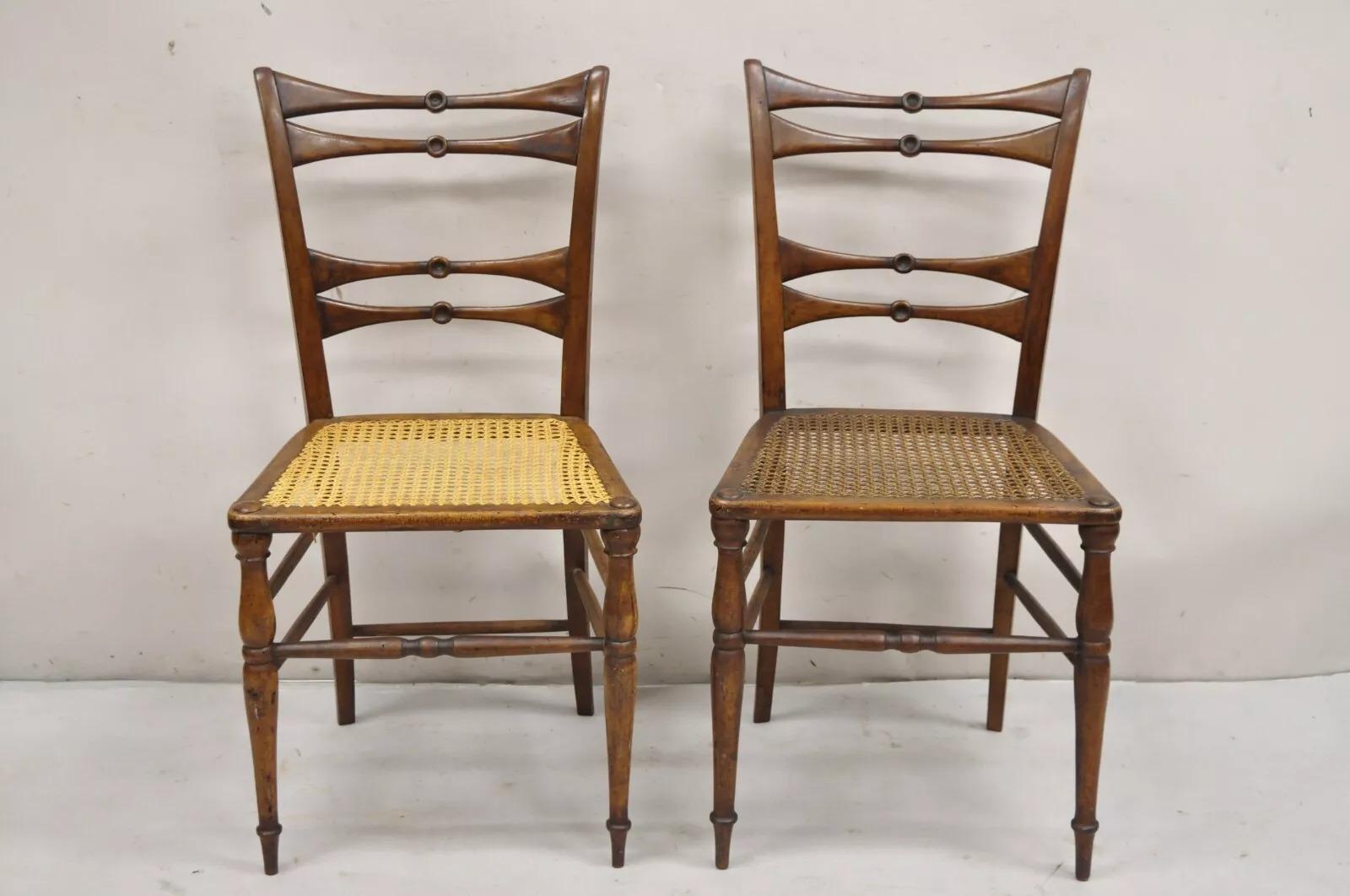 Antique Italian Biedermeier Arts & Crafts Walnut Bowtie Chiavari Side Chairs - a Pair. Chairs feature clean lines, turn carved spindle legs and stretchers, cane seats, very unique 