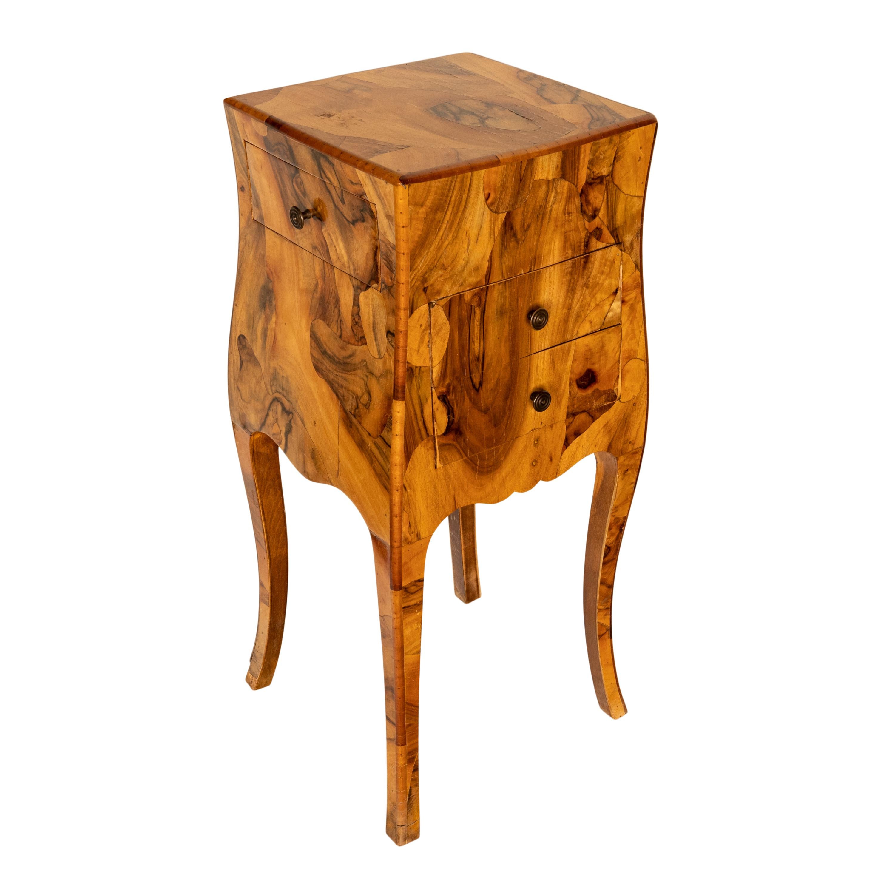 A very elegant antique Italian oyster wood & walnut side table, cabinet, nightstand, circa 1900.
The stand of bombe shaped form and extravagantly decorated with a patchwork of 'oyster' cut woods, the cabinet with an interesting drawer configuration;