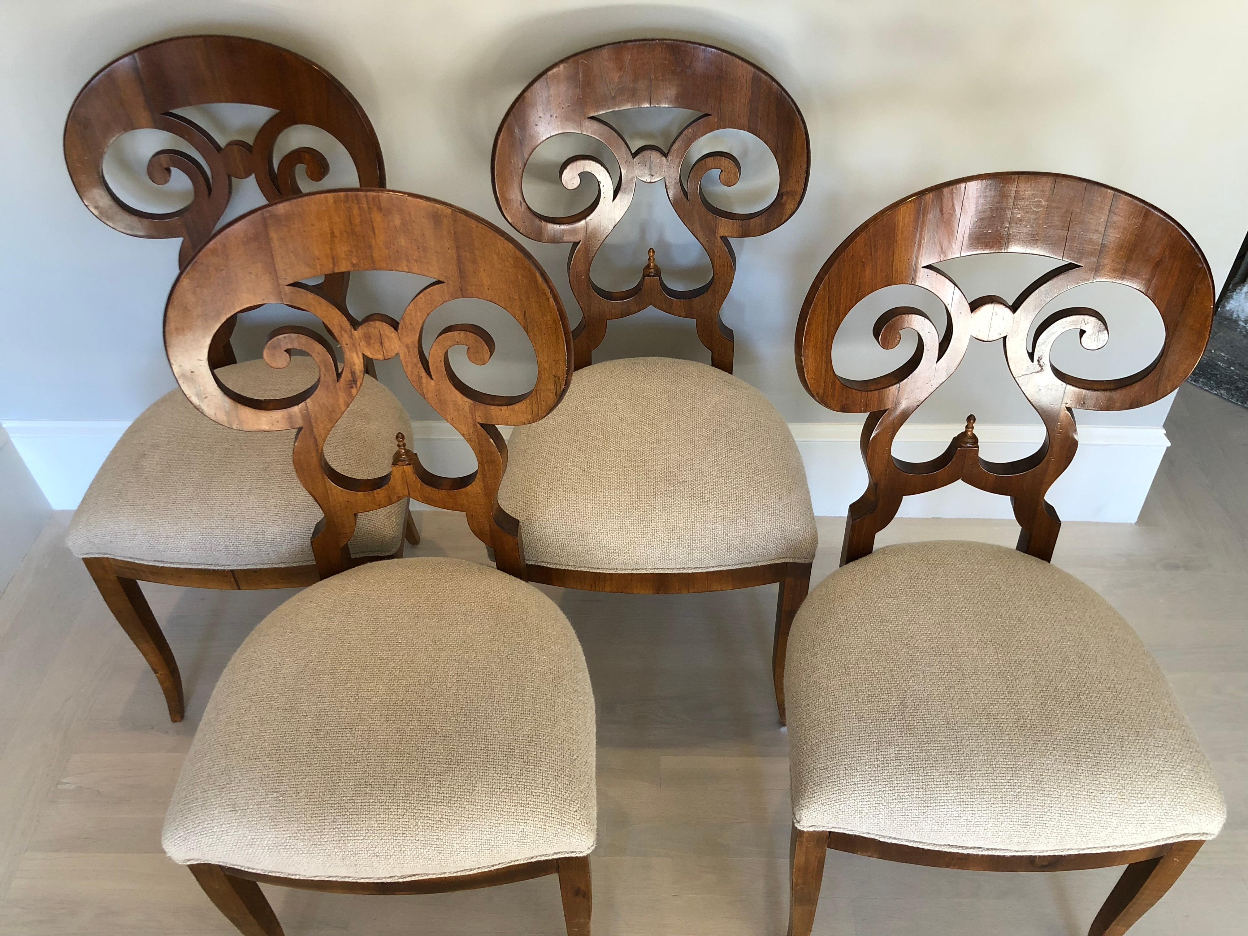 Set of 4 Italian Biedermeier style dining chairs. Chairs have been recently polished and restored. Recently upholstered in beige chenille fabric.