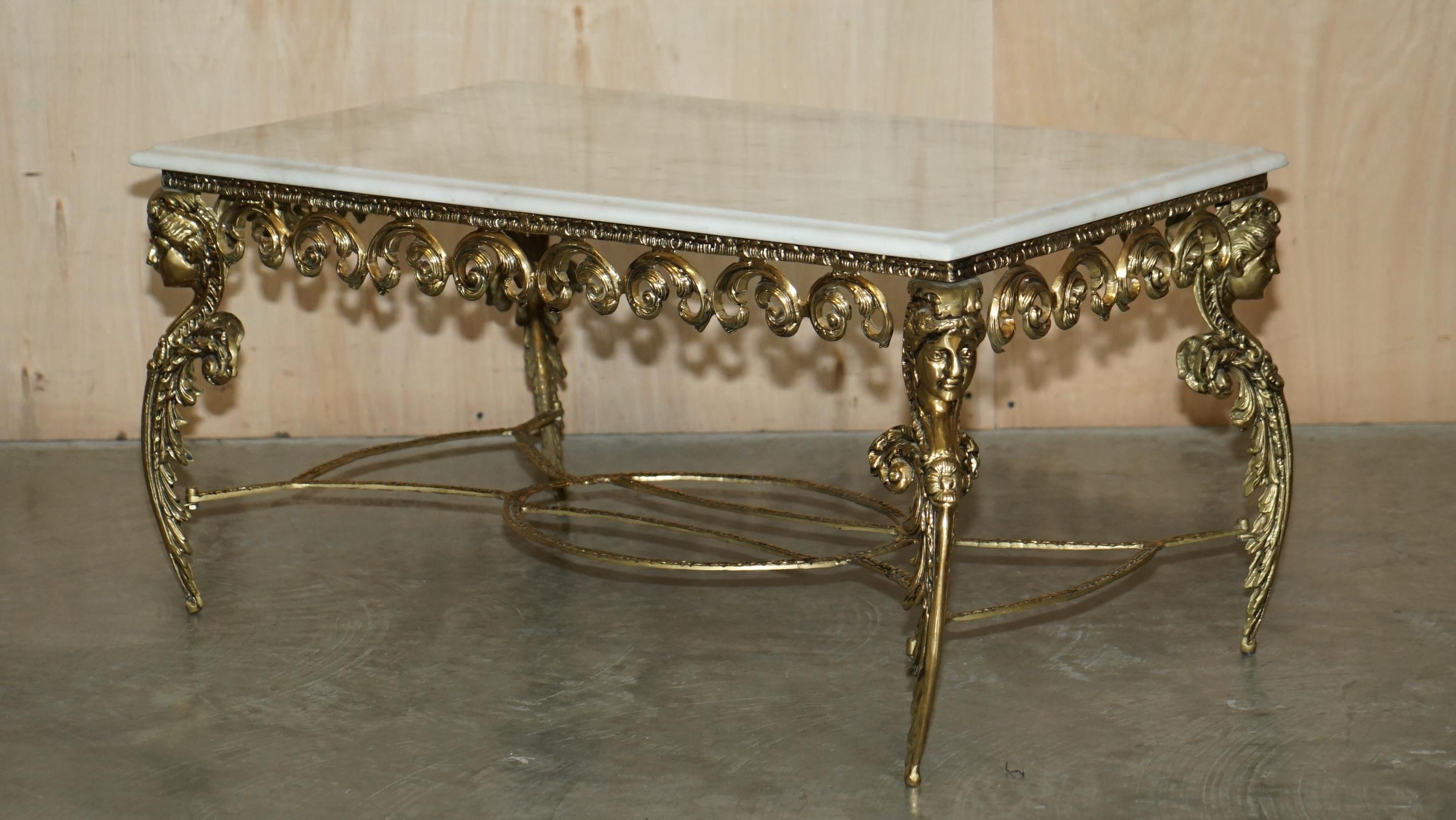 We are delighted to offer for sale this lovely hand made in Italy brass framed coffee table with thick Carrara marble top.

A very well made and good looking table. The marble top is extremely thick and beautifully veined, it sits on a very ornate
