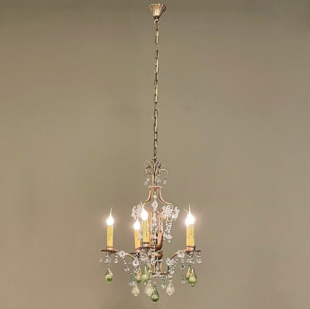 Antique Italian brass & crystal chandelier from Venice features a stunning neoclassical revival design with a Venetian flair that will captivate the visual senses! What's more, the elegant scrolls of the fixture are finished with gold paint for an